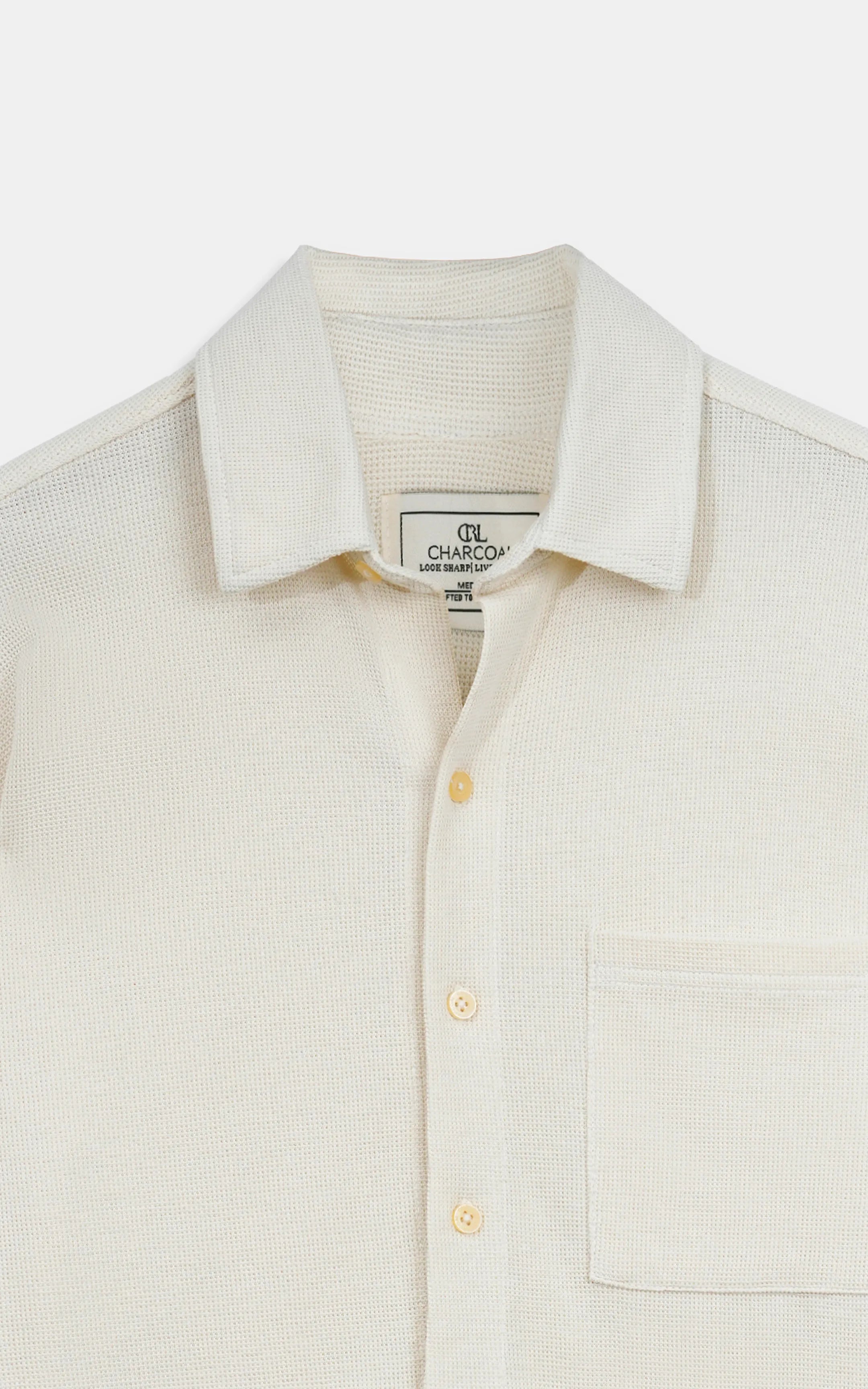 Off-white knit casual shirt neckline with button placket and CHARCOAL label