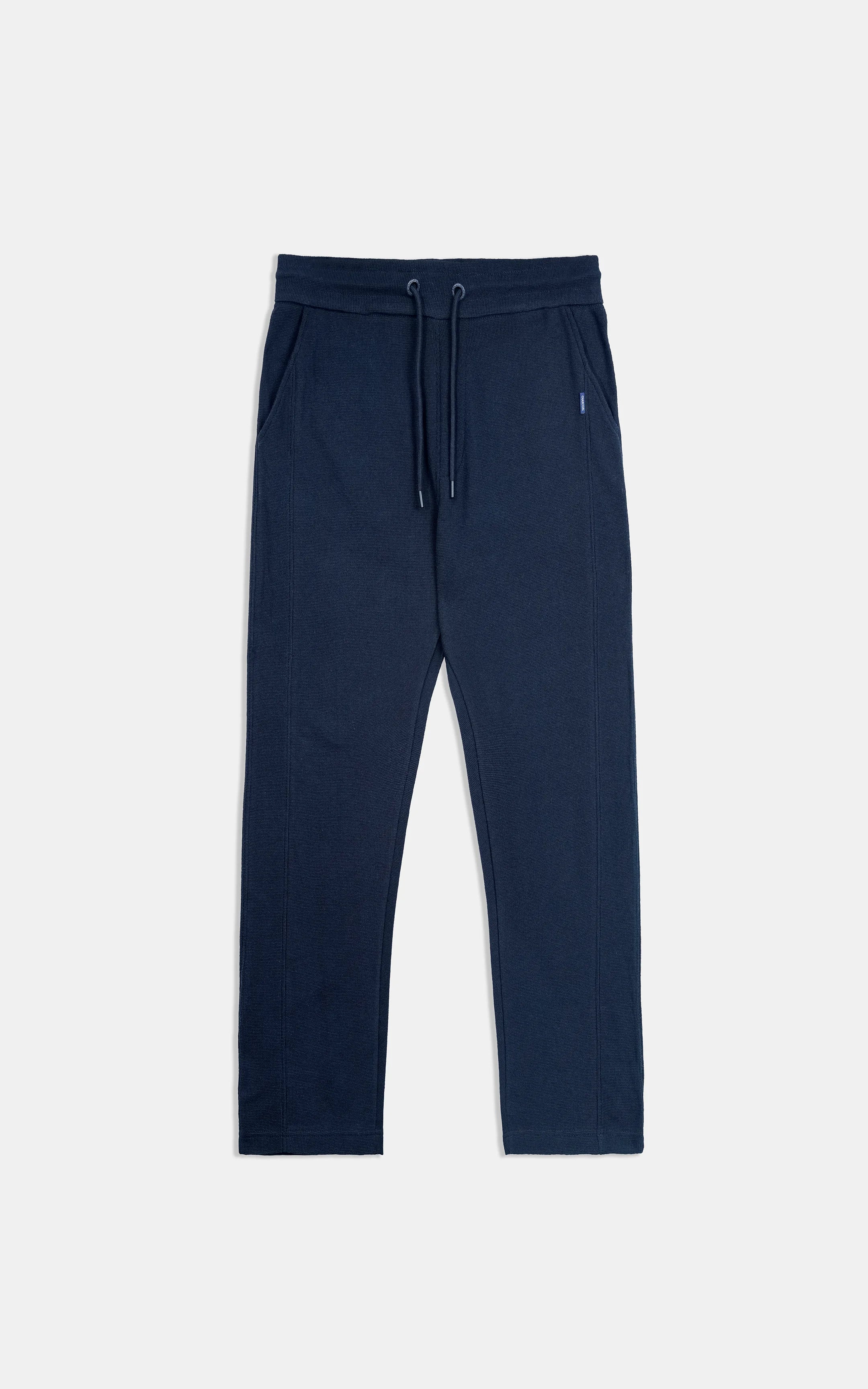 Navy knit trousers with drawstring waistband and straight loose legs