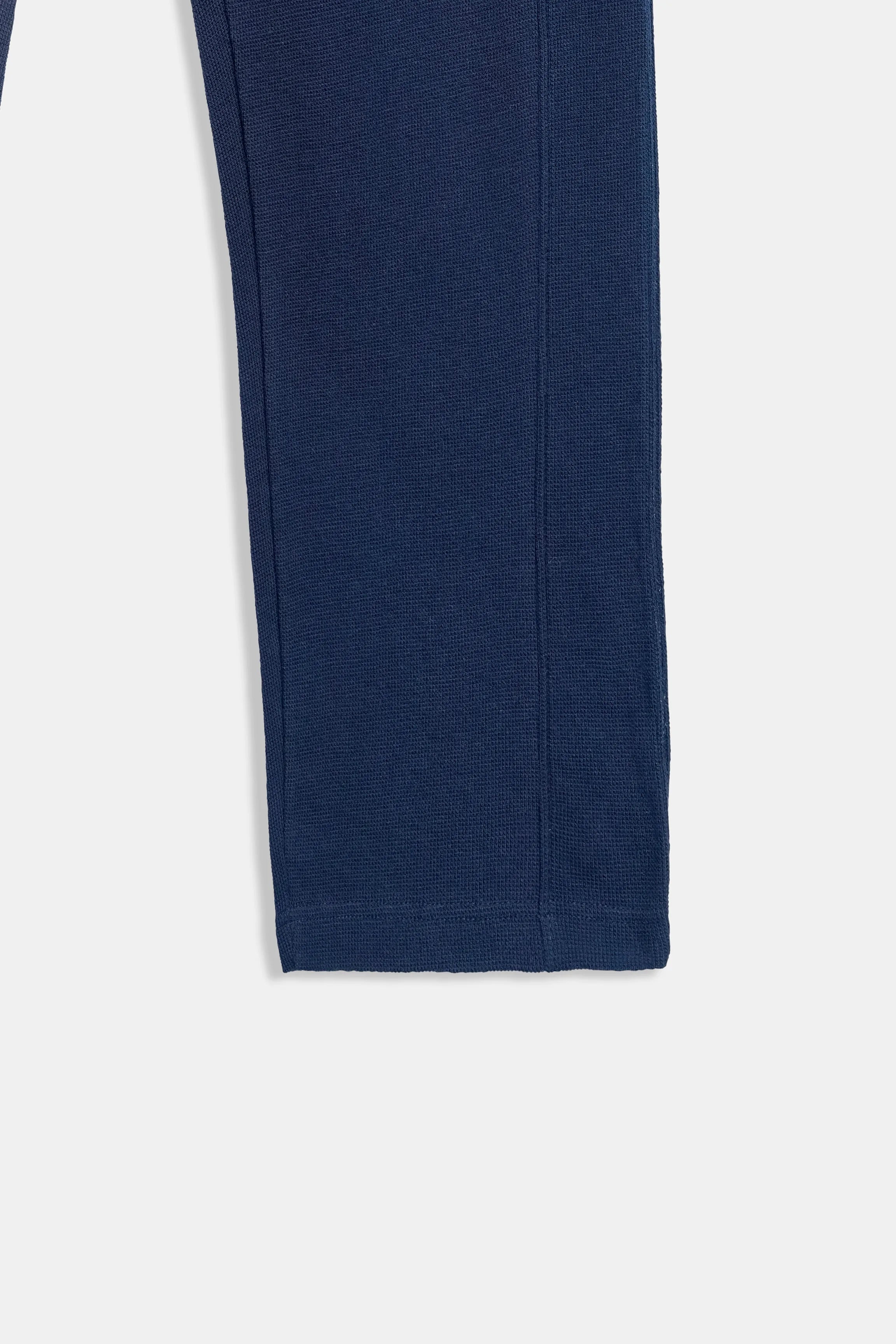 Navy knit trouser leg with vertical seam detail