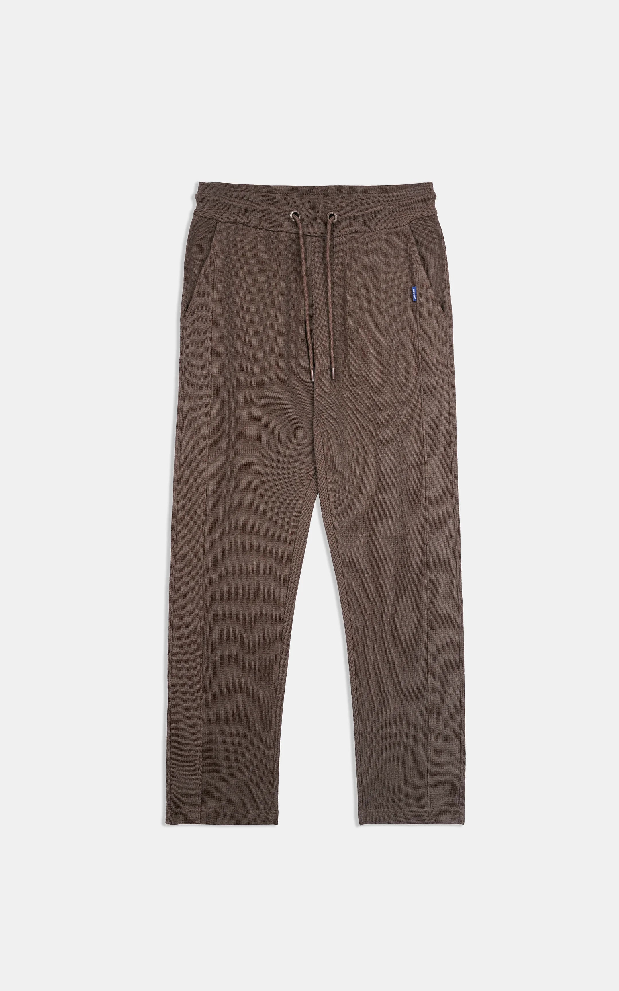 Brown knit trousers with drawstring waistband and relaxed tapered legs