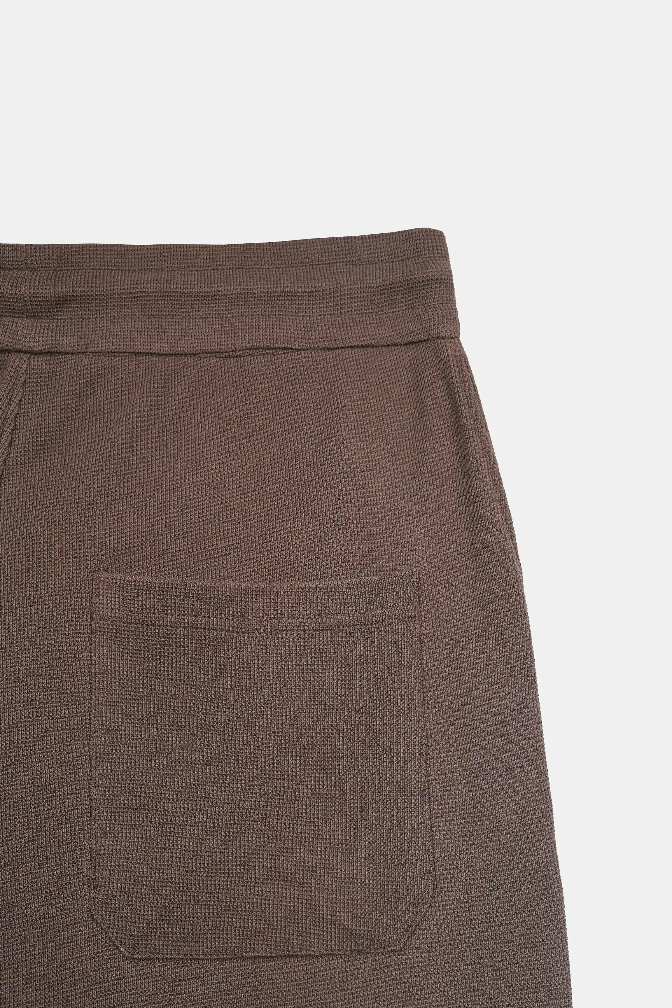 Brown knit trouser side pocket with stitched seam detail
