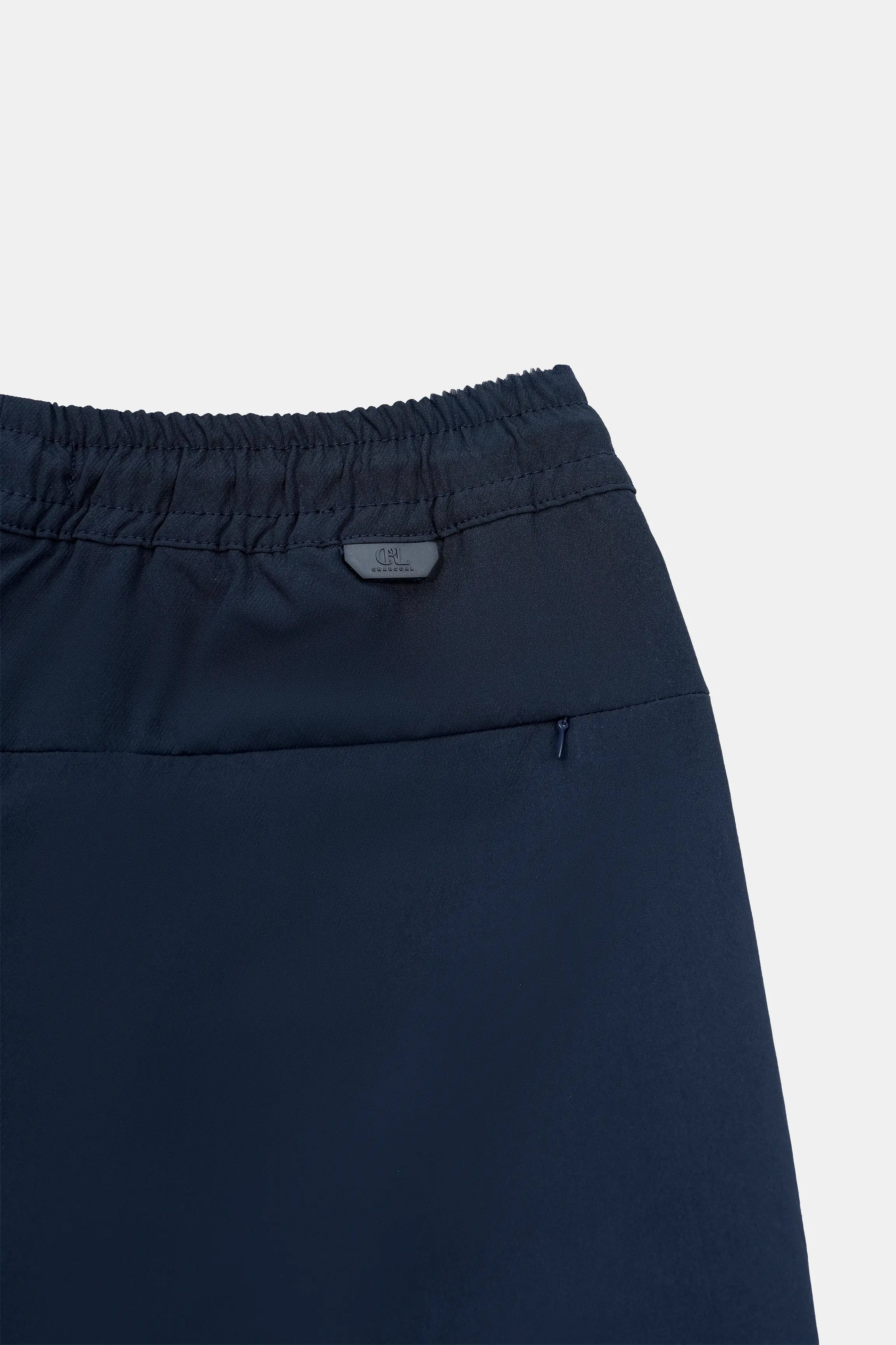 Navy regular-fit shorts, logo tag and elastic waist close-up