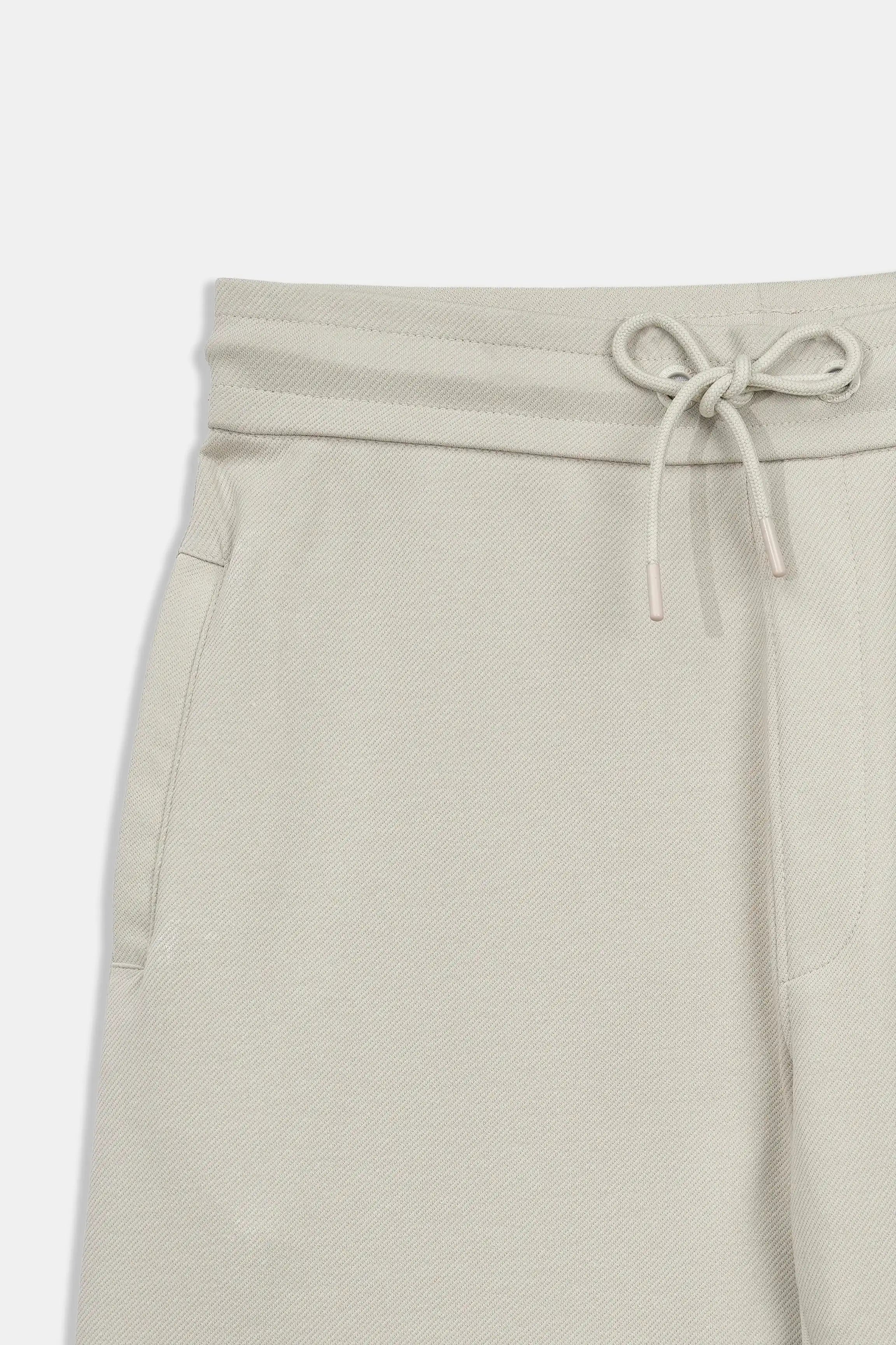 Stone shorts waistband close-up with drawstring and elastic casing