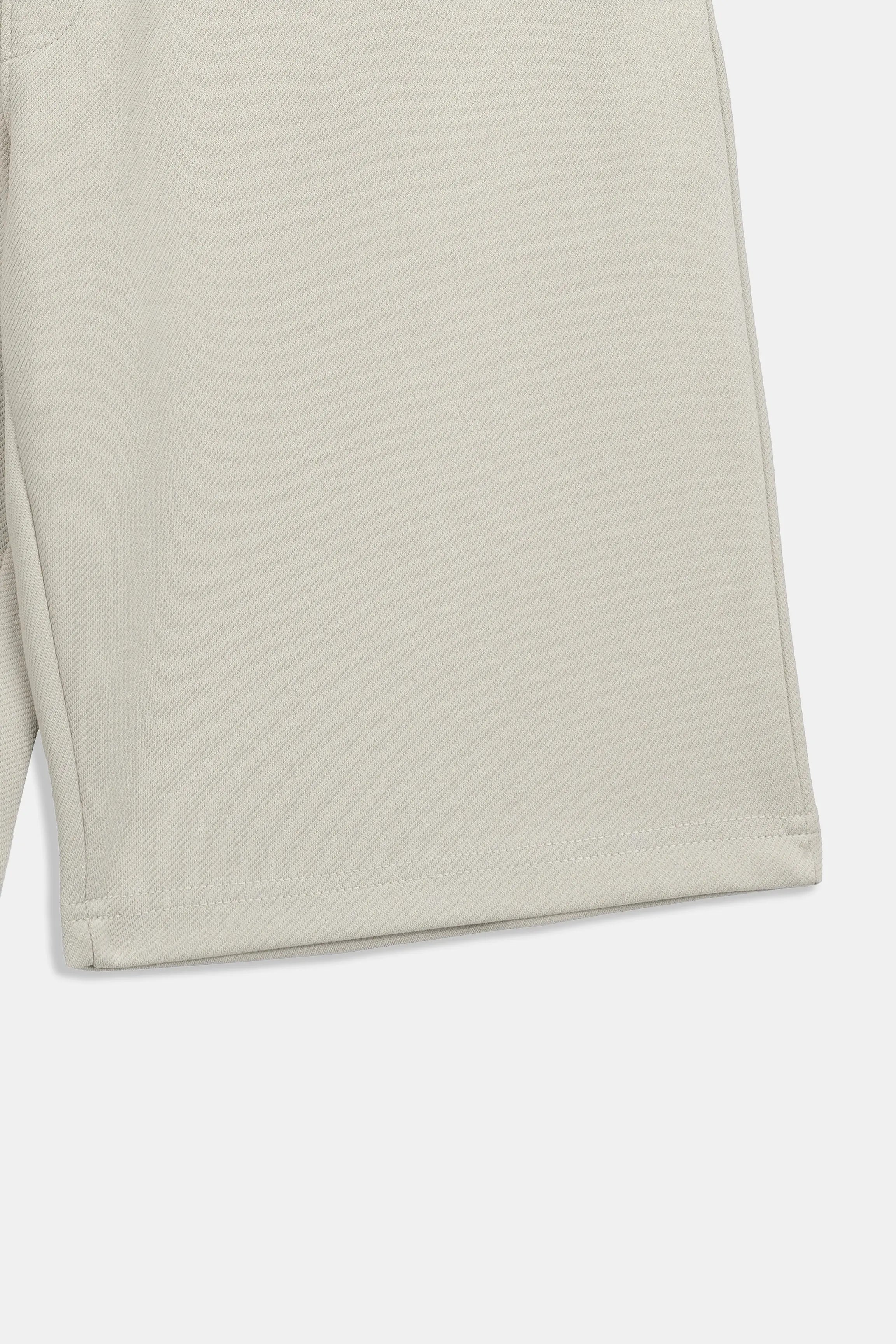 Stone regular-fit shorts with clean hem and smooth fabric texture