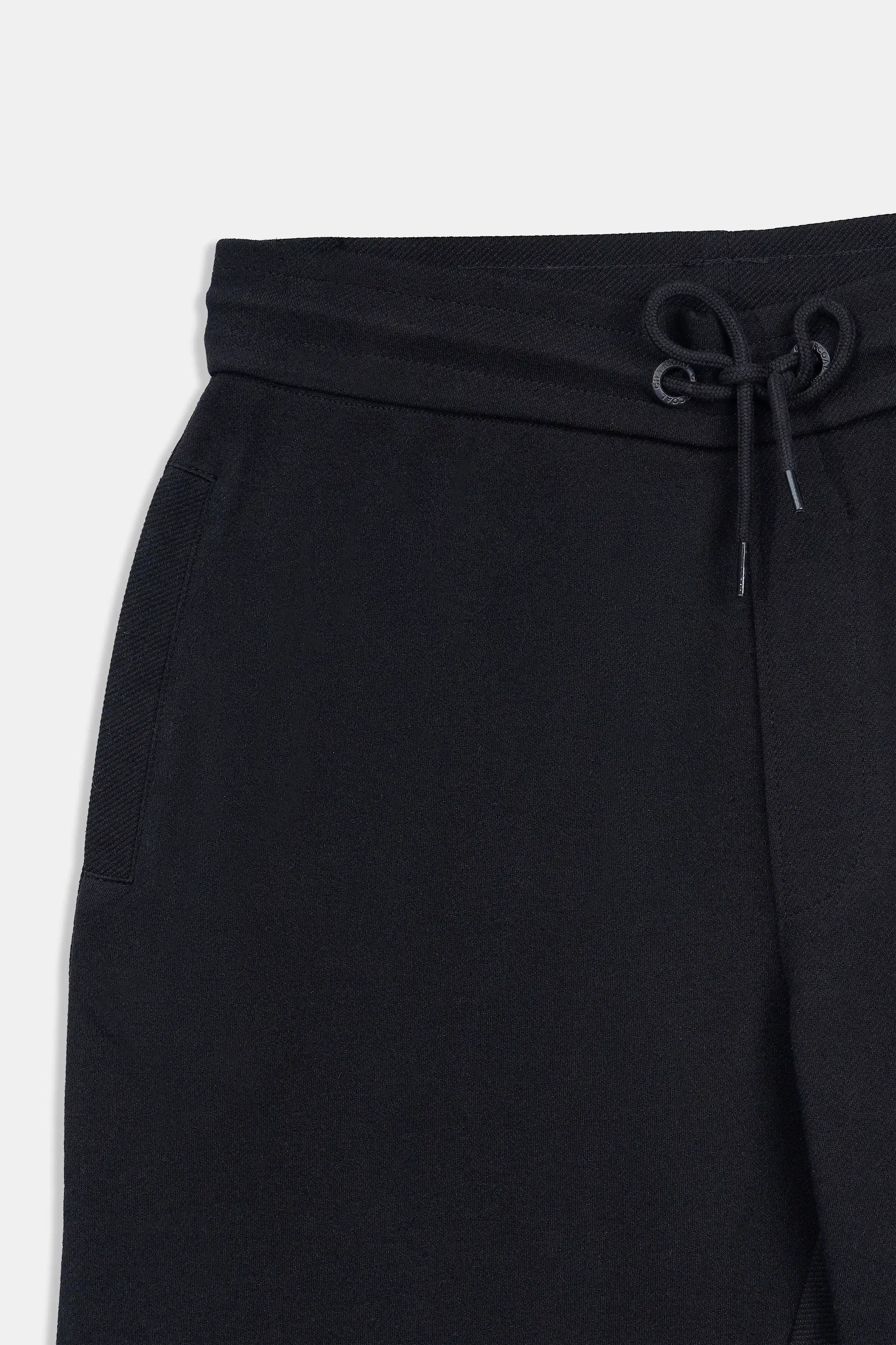 Black shorts waistband with elastic casing and drawstring cord
