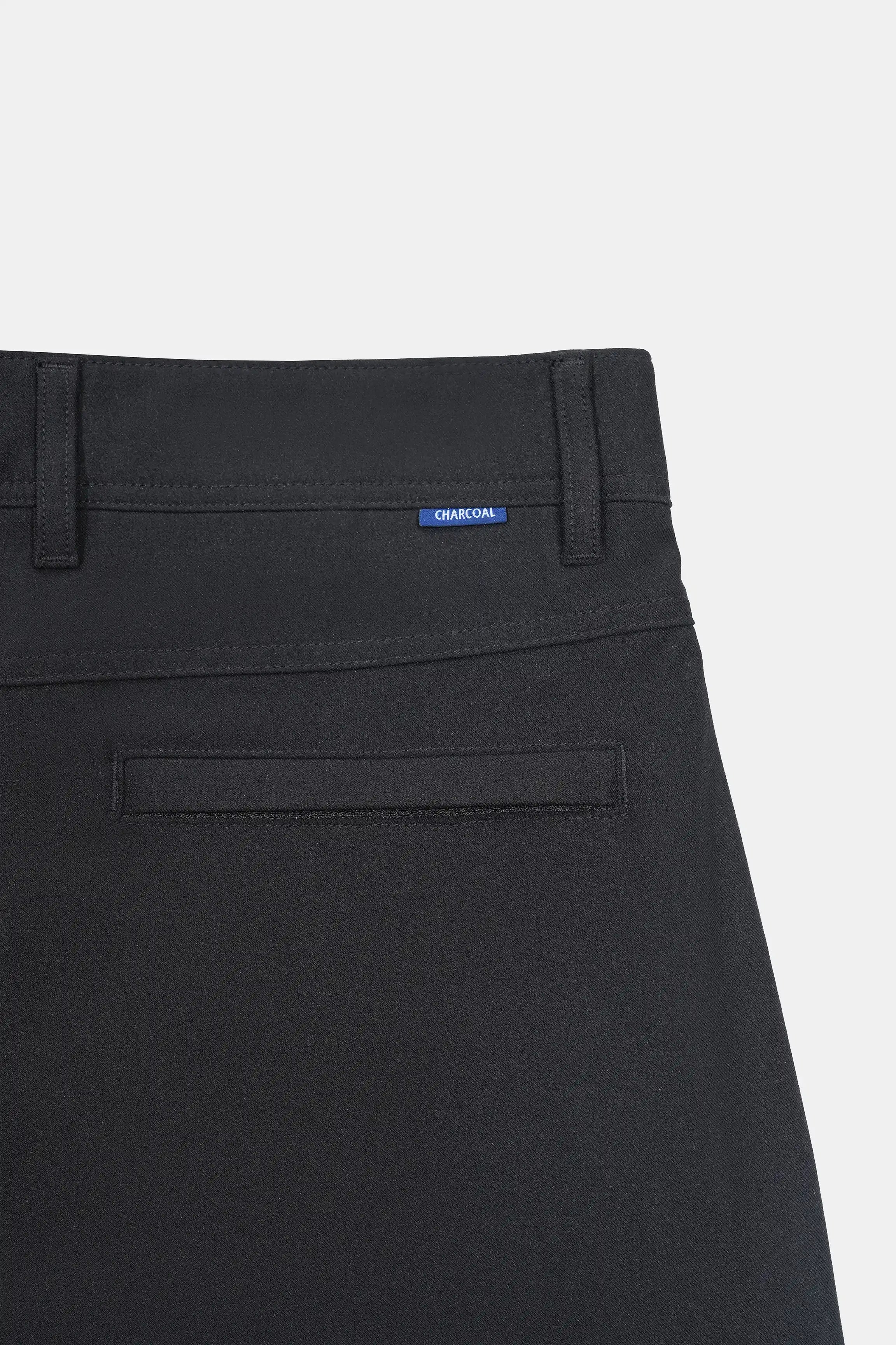 Black straight-fit travel pants front pocket with belt loops and logo patch detail