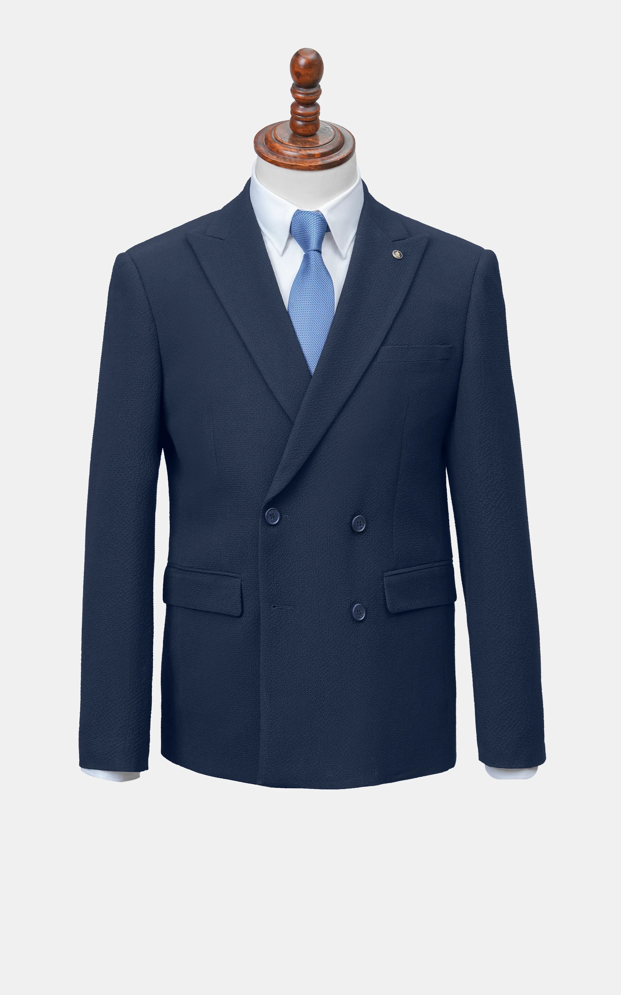 Navy double-breasted blazer with notch lapels, two-button front, flap pockets