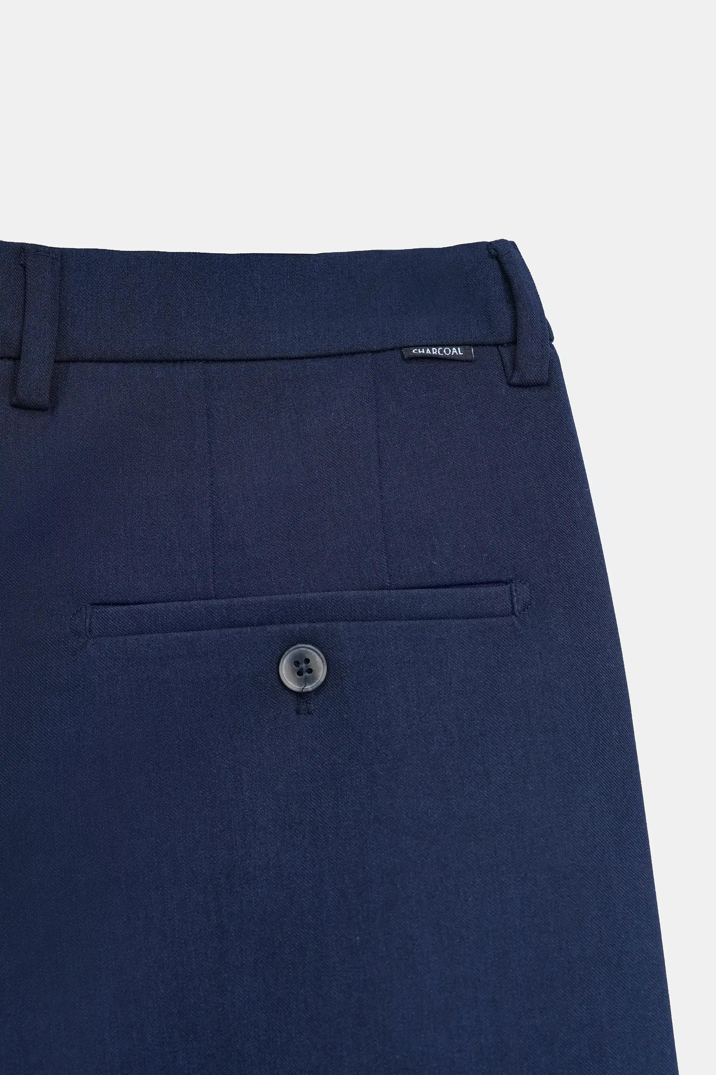 Blue straight-leg casual pants close-up with button fly and welt pocket