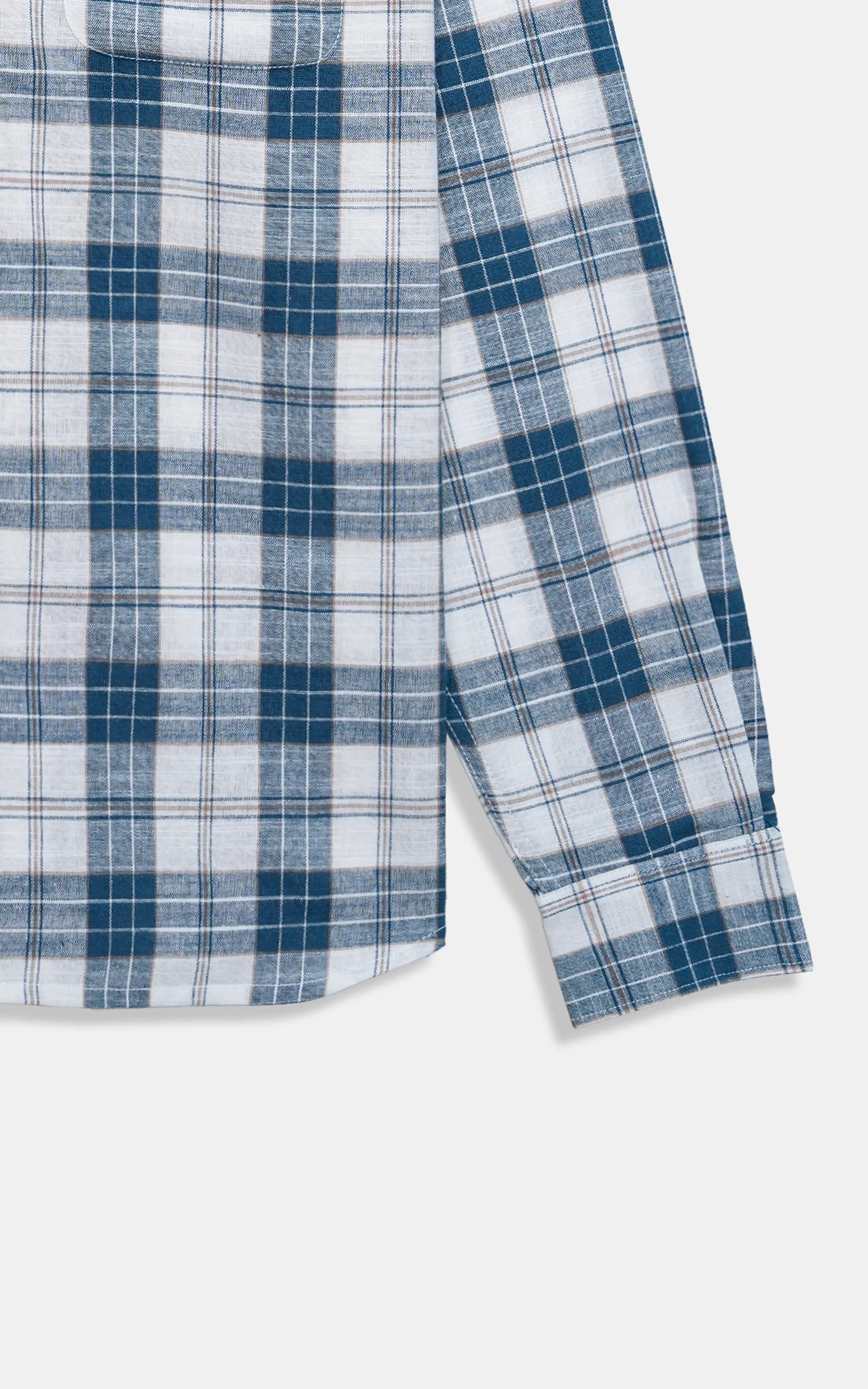 Navy and white plaid shirt fabric detail with stitched cuff and hem