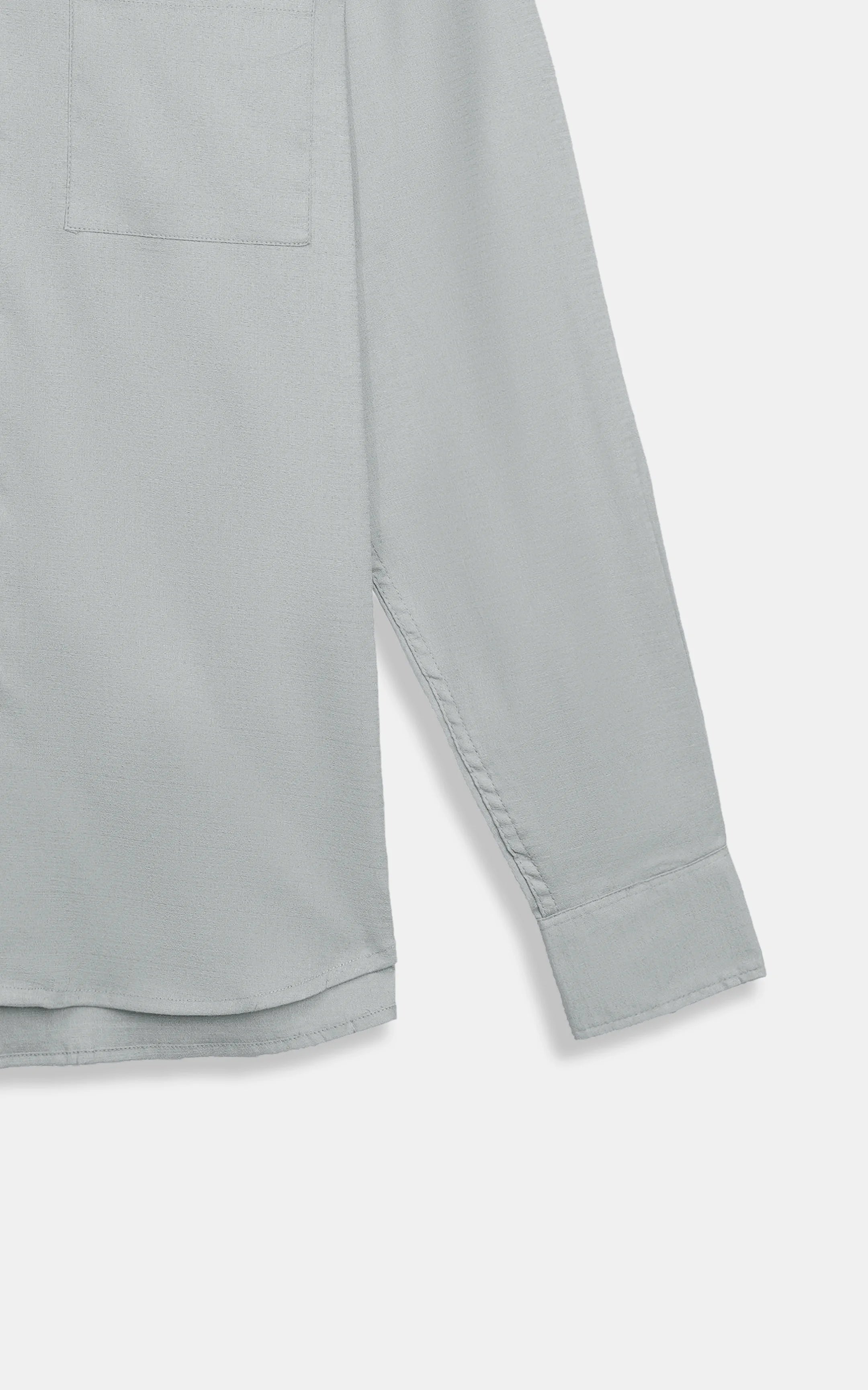 Grey button-down casual shirt sleeve and hem detail, long cuffed sleeve.
