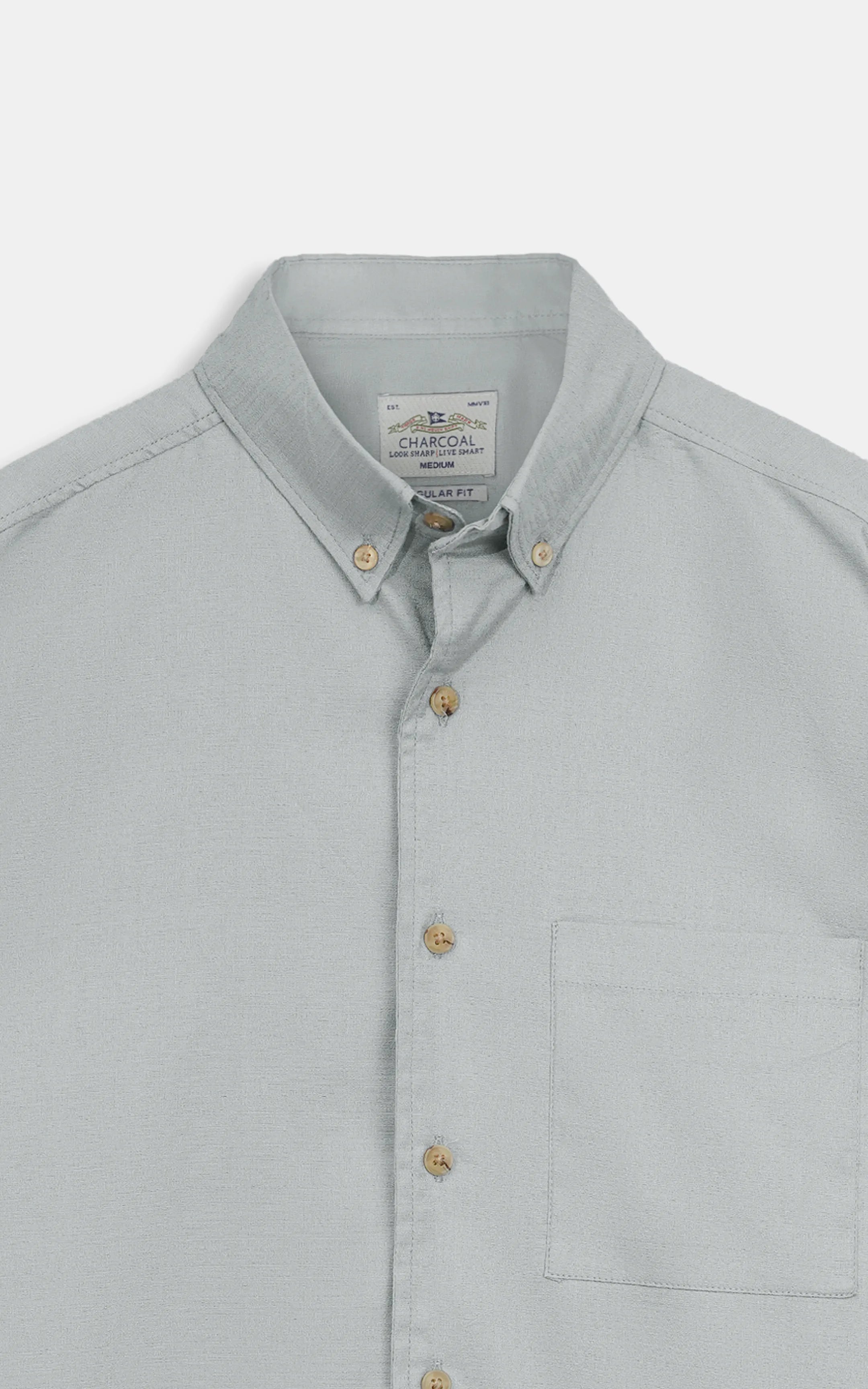 Grey button-down casual shirt close-up: collar, buttons, and chest pocket.