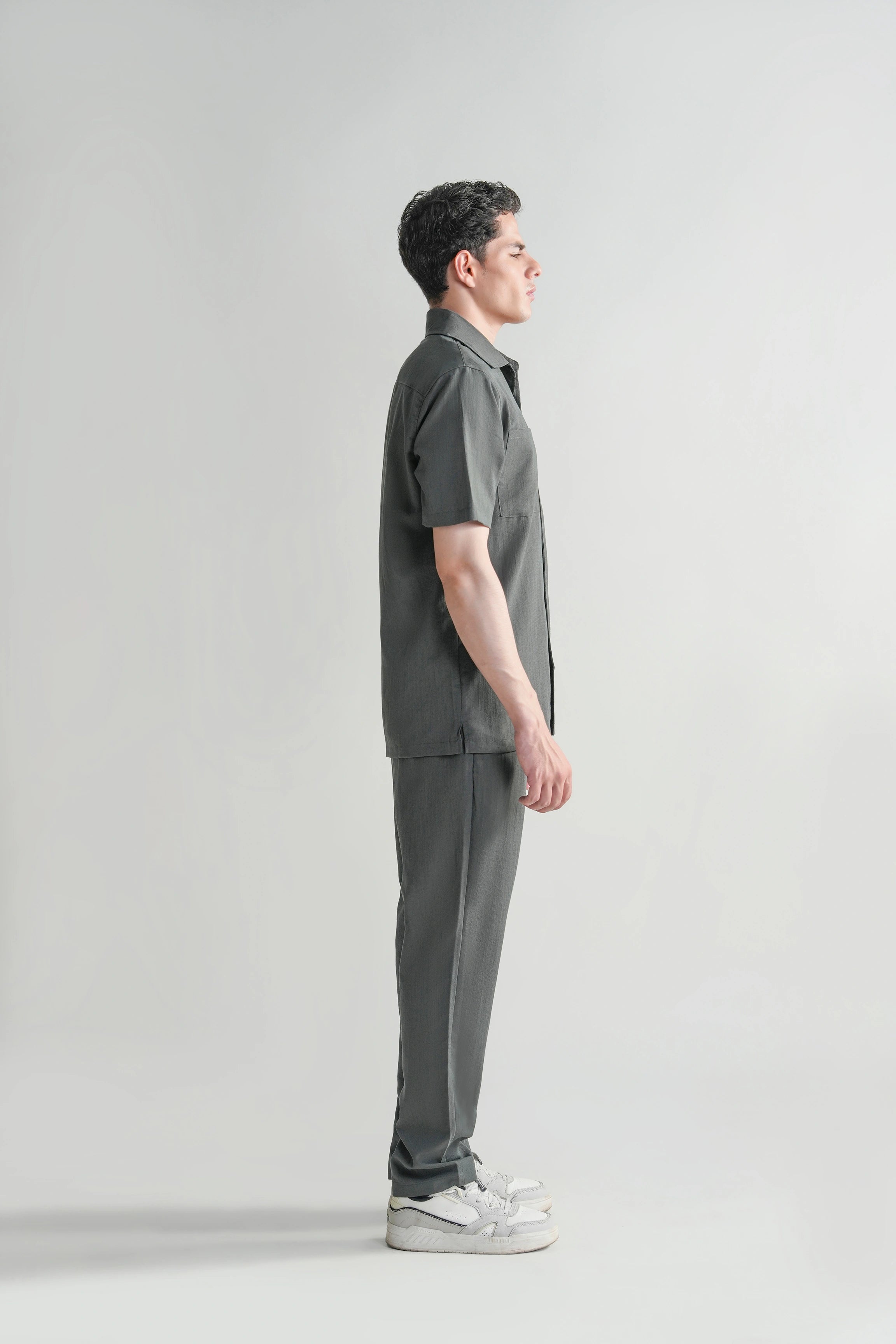 Dark grey casual short-sleeve shirt with regular collar, side profile