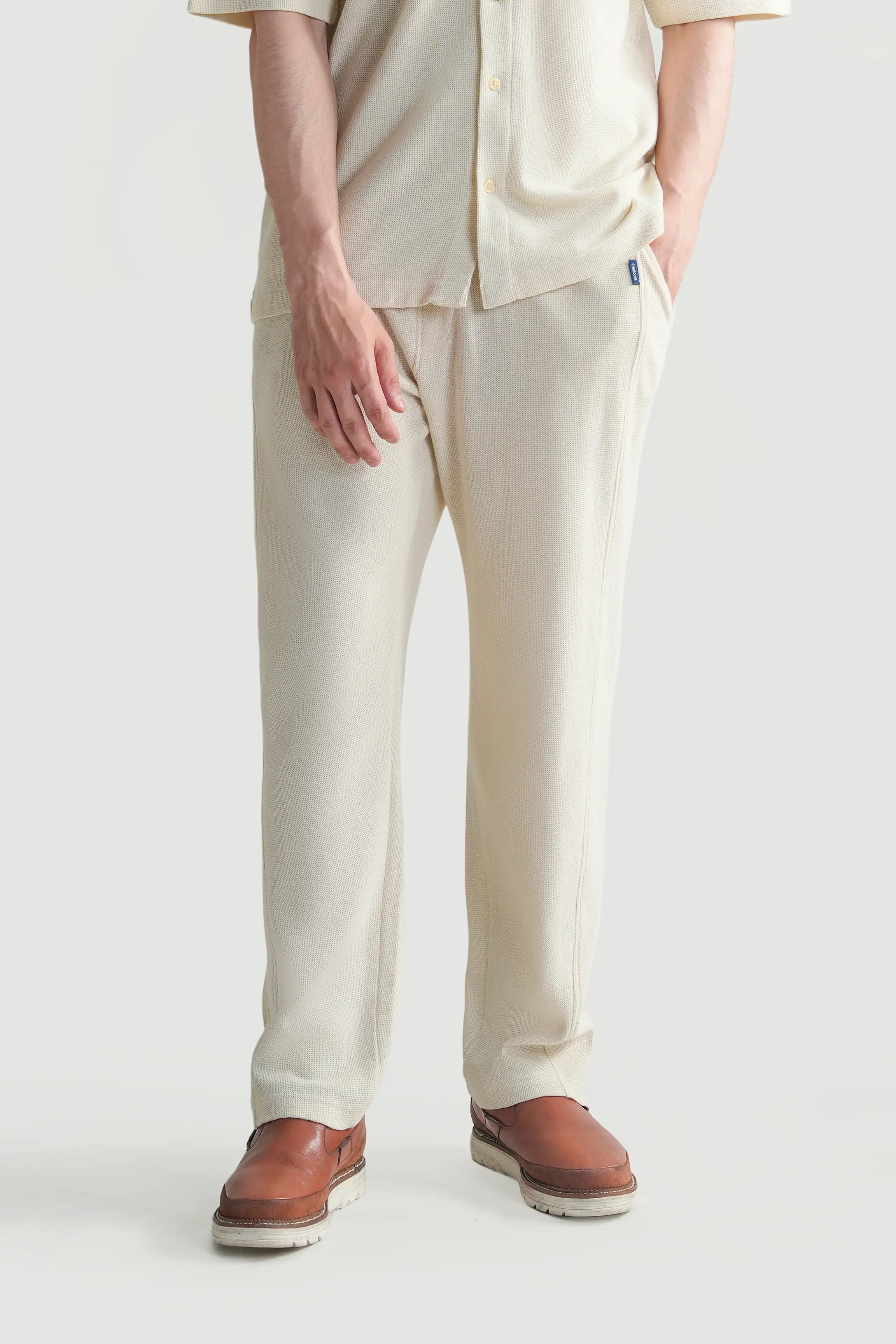 Off-white knit loose trousers, side view, ankle length
