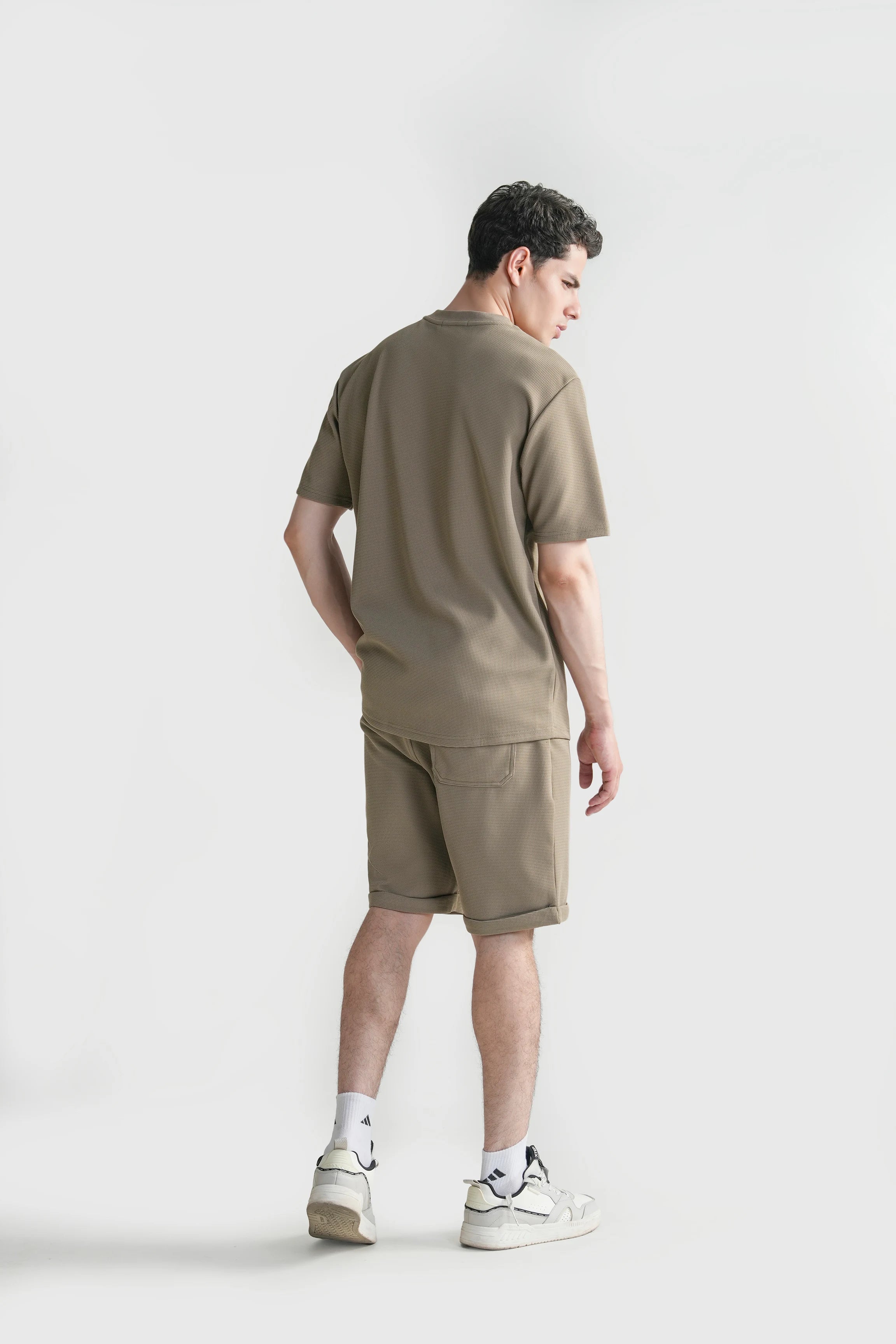Oversized crew neck T-shirt in muted green, back view with crew collar