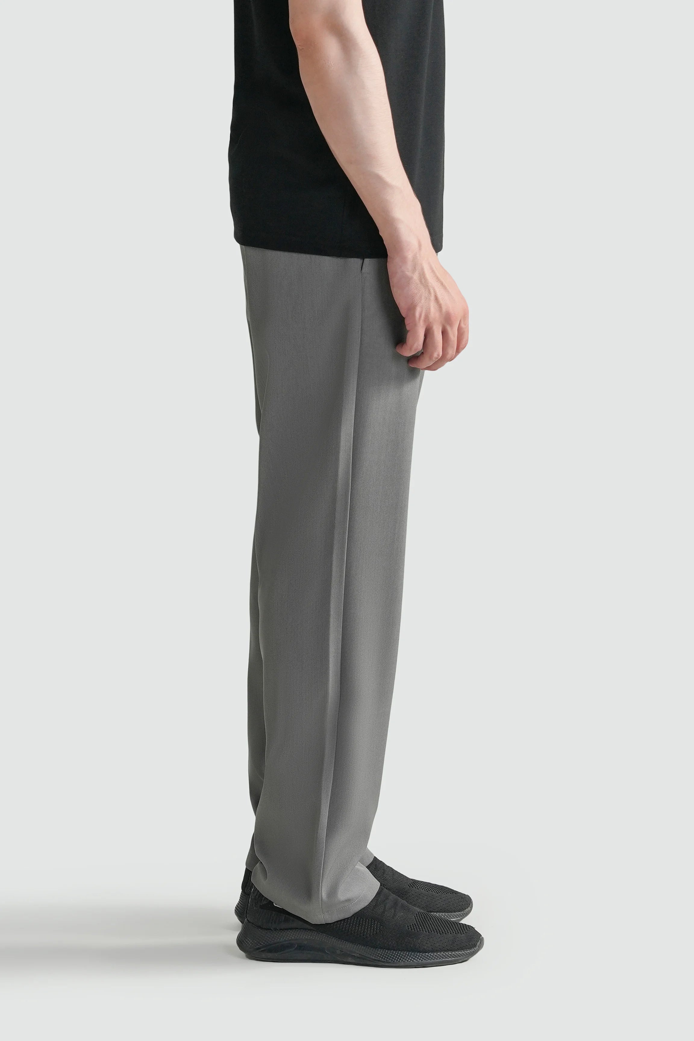 Grey straight-fit casual pants shown from the side with clean leg line