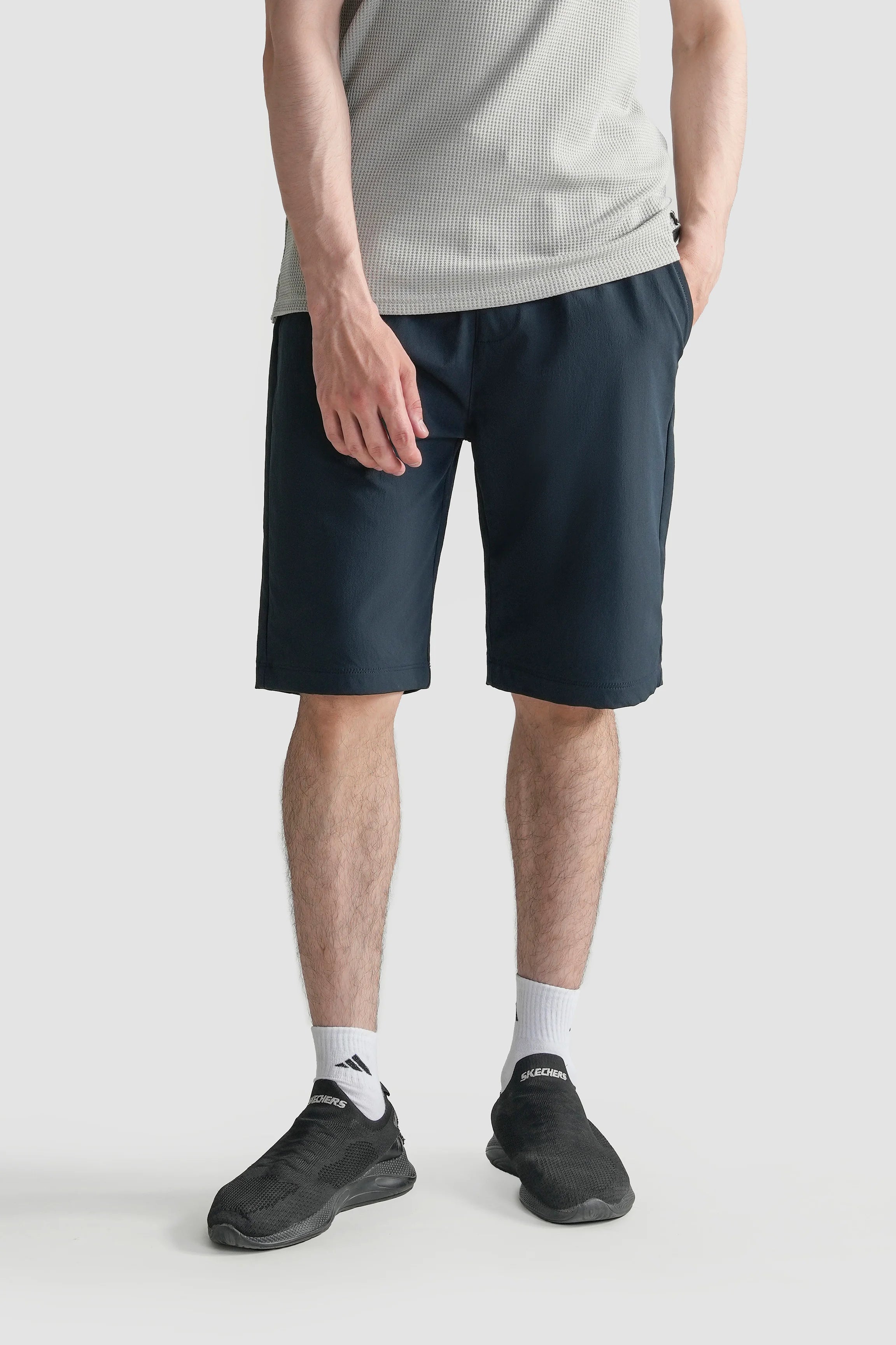 Navy regular-fit shorts with drawstring waist, side pockets, knee length