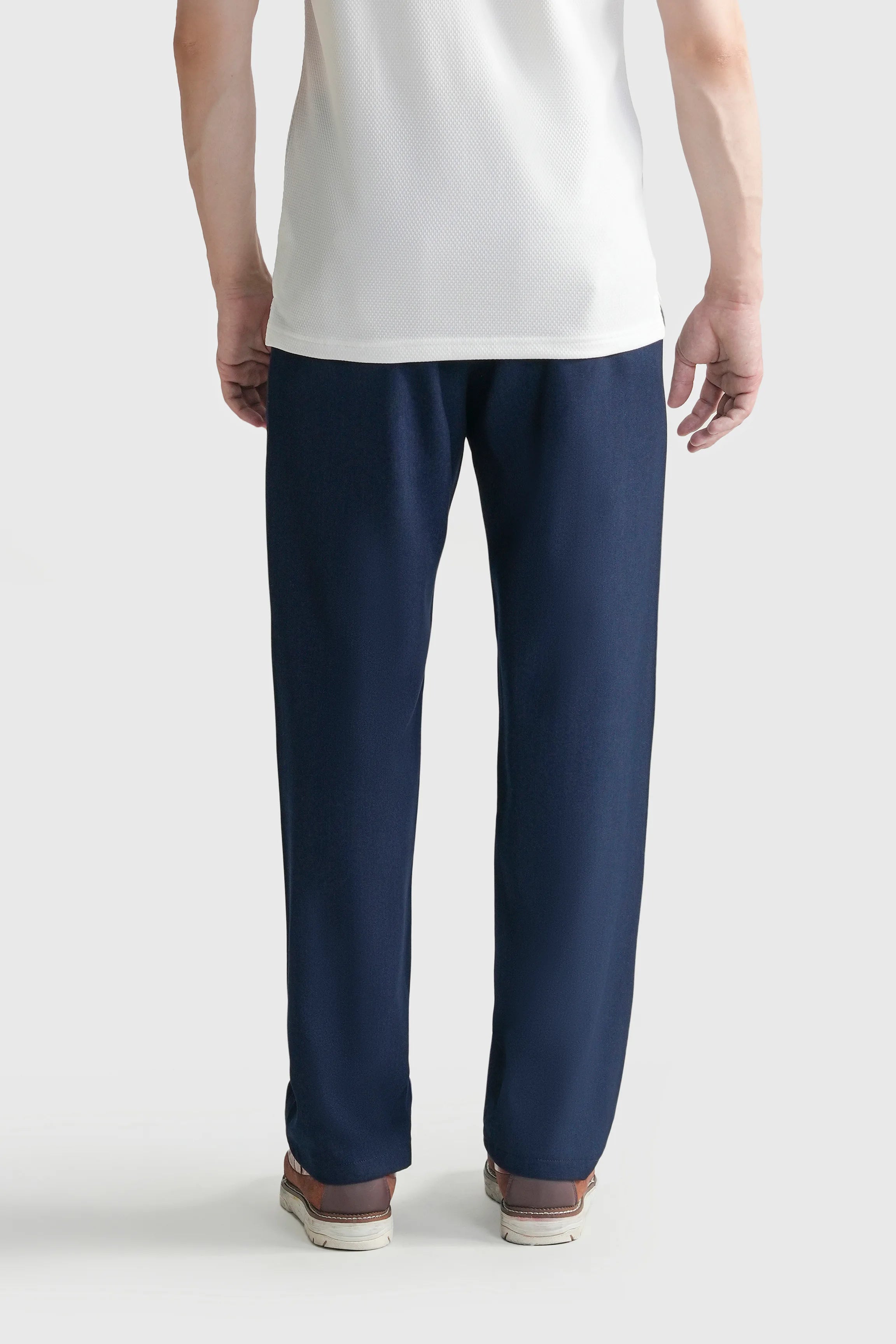 Blue straight-leg casual pants, front view with tapered legs and ankle hem