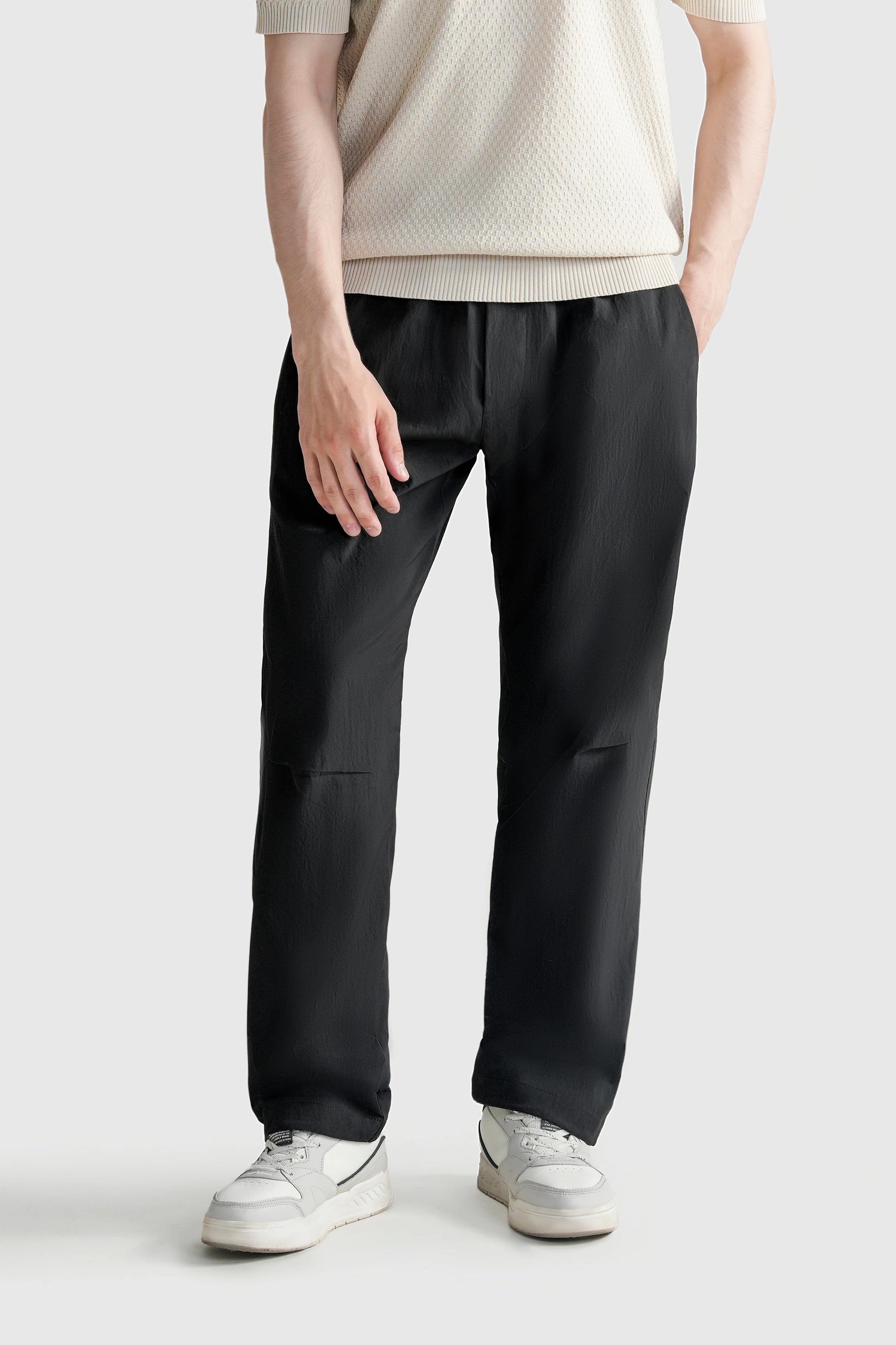 Black loose-fit casual trousers with relaxed wide legs and side pockets