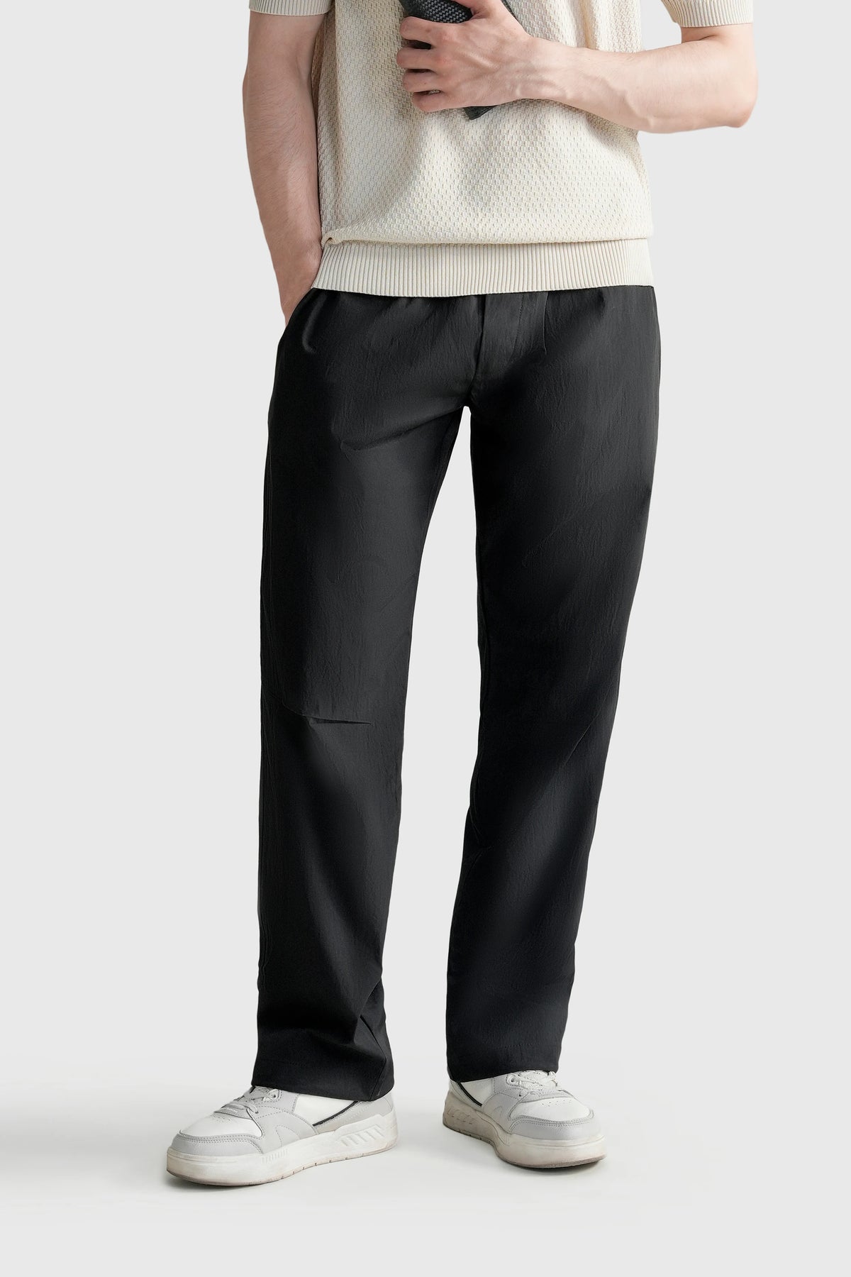 Black loose-fit trousers with elastic waist and relaxed wide legs