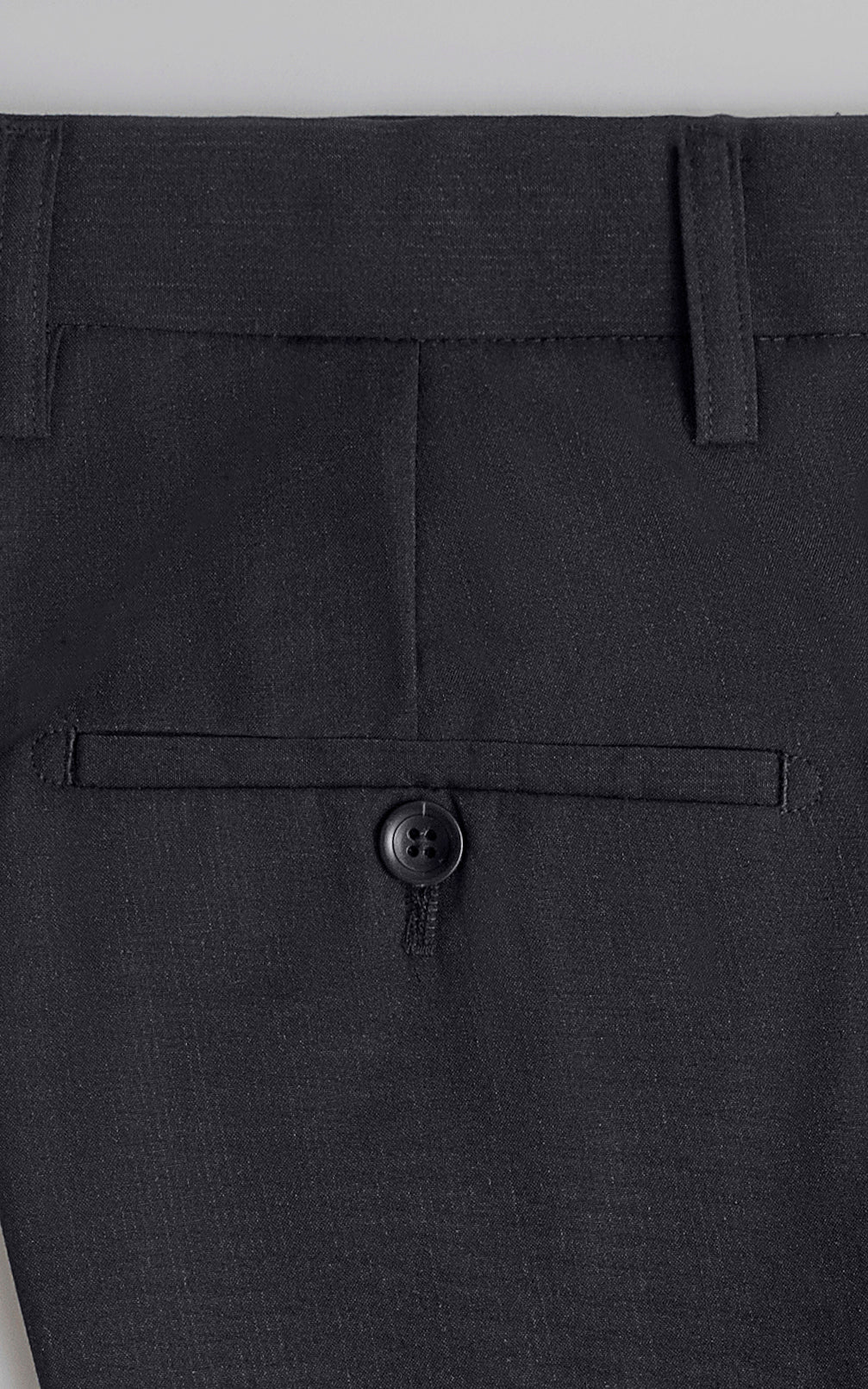 Black waistband with button closure and belt loops