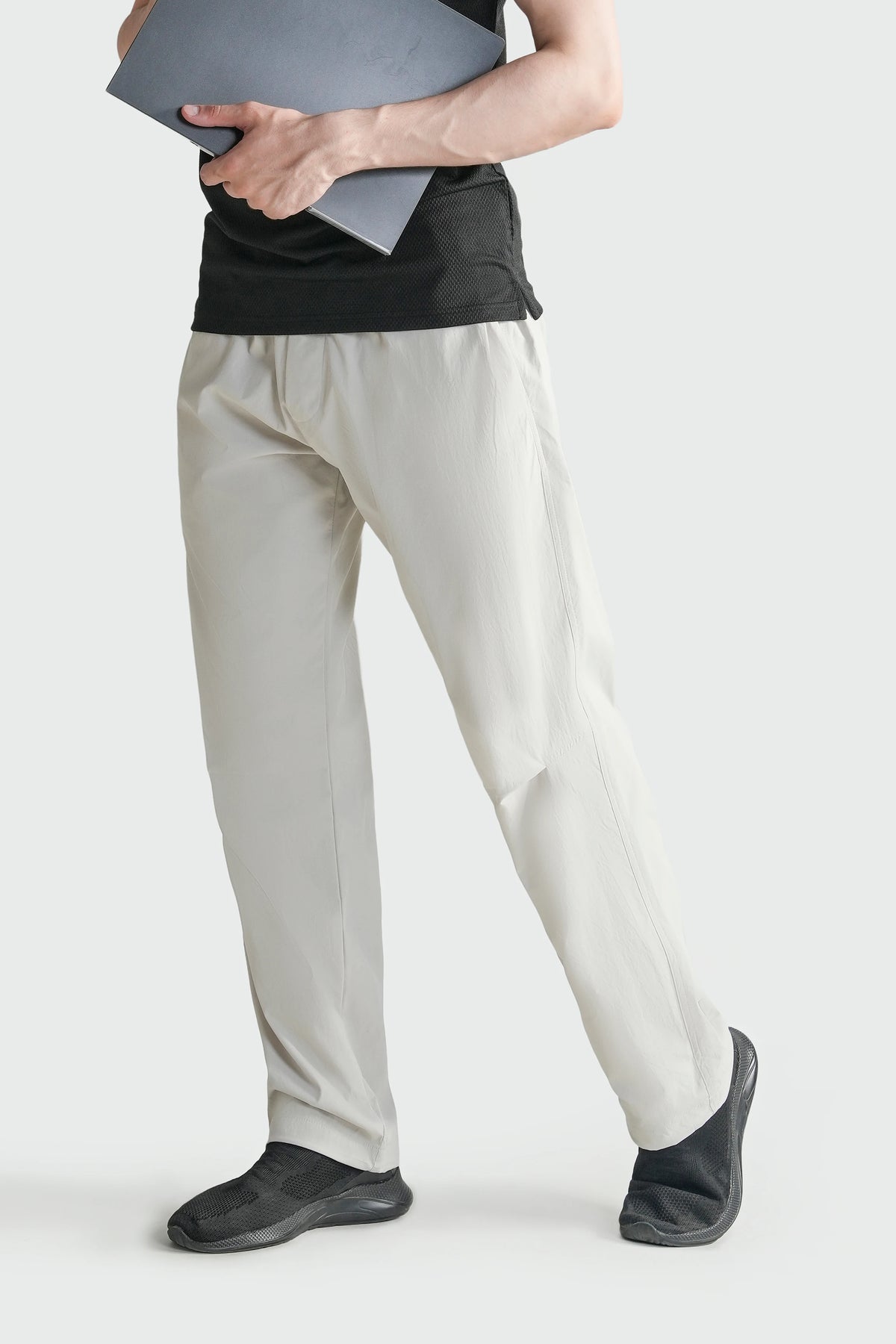 Stone loose-fit casual trousers with elastic waist and ankle-length straight legs