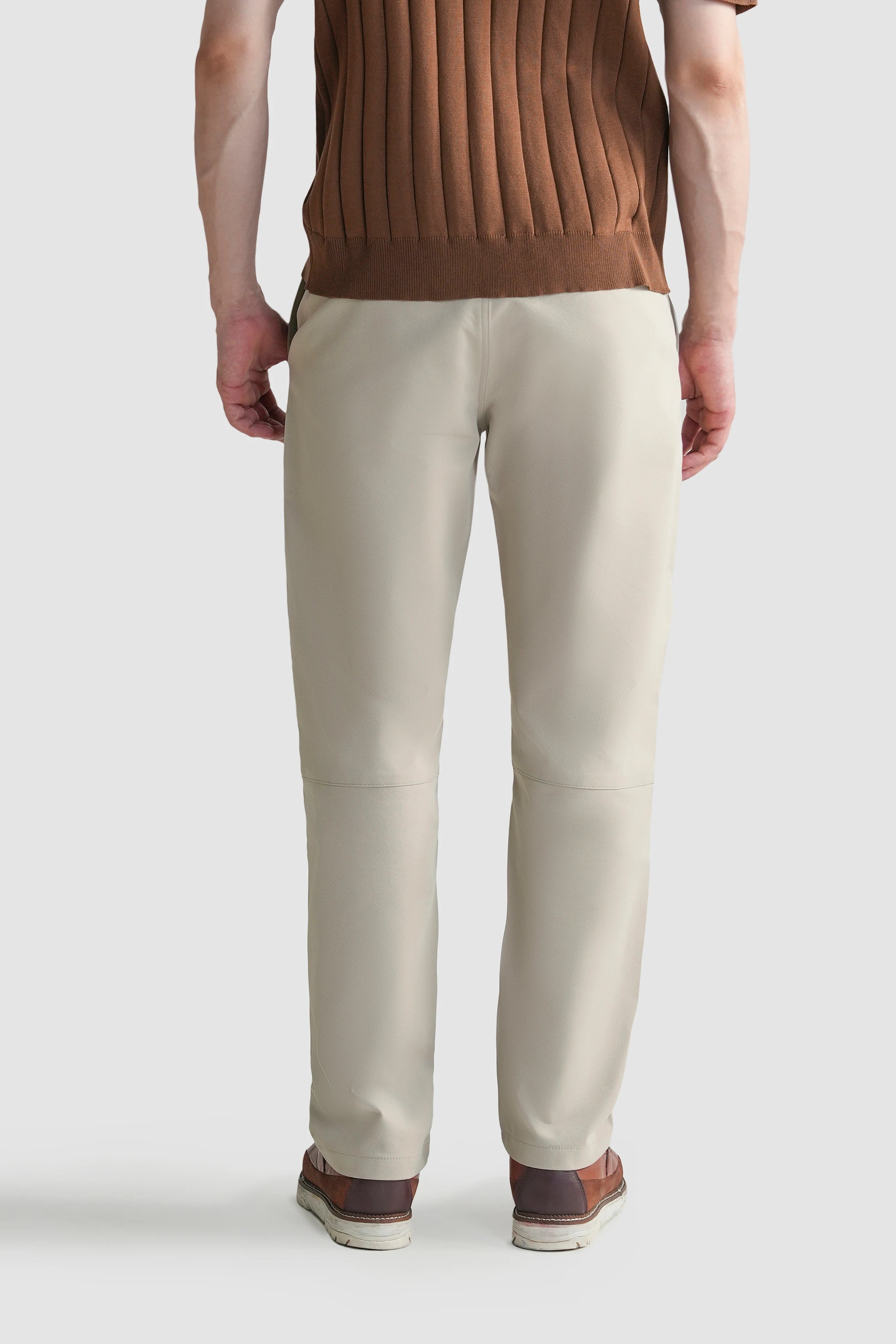 Light beige straight-fit travel pants with two back pockets