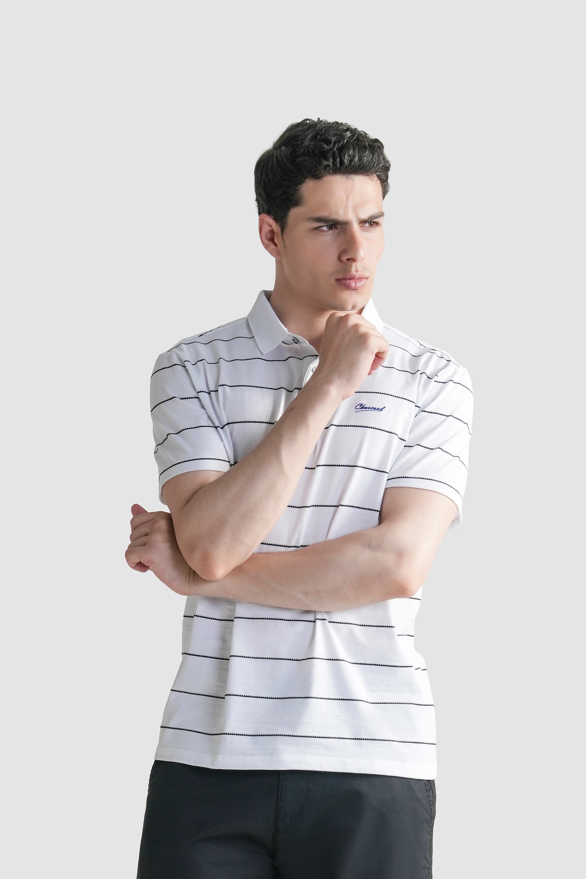White striped polo shirt with chest logo and three-button placket