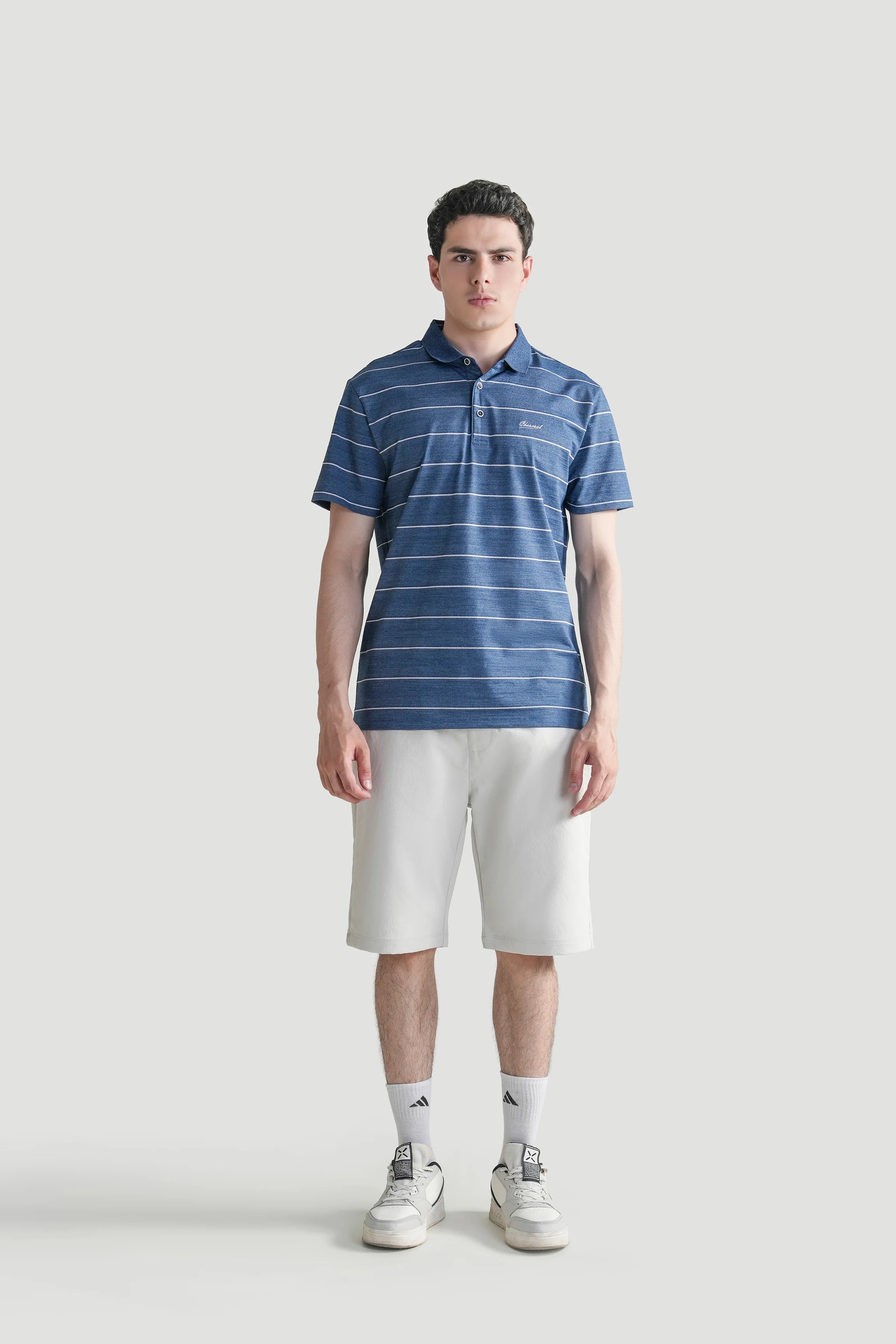 Blue striped polo shirt with short sleeves and button placket