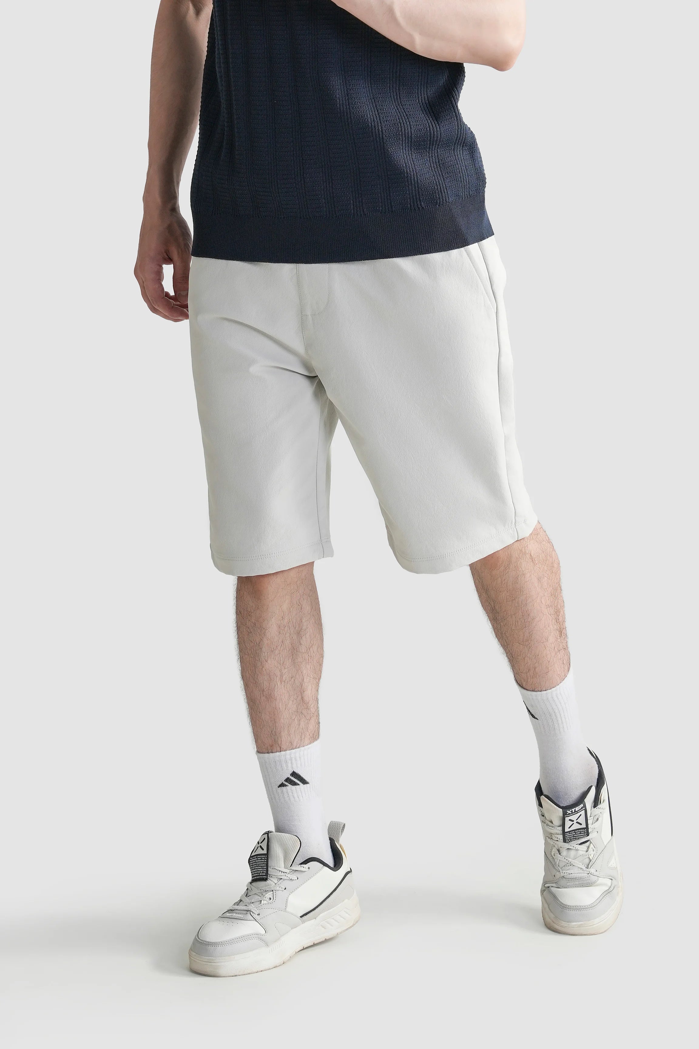 Regular-fit shorts in light color, front three-quarter view