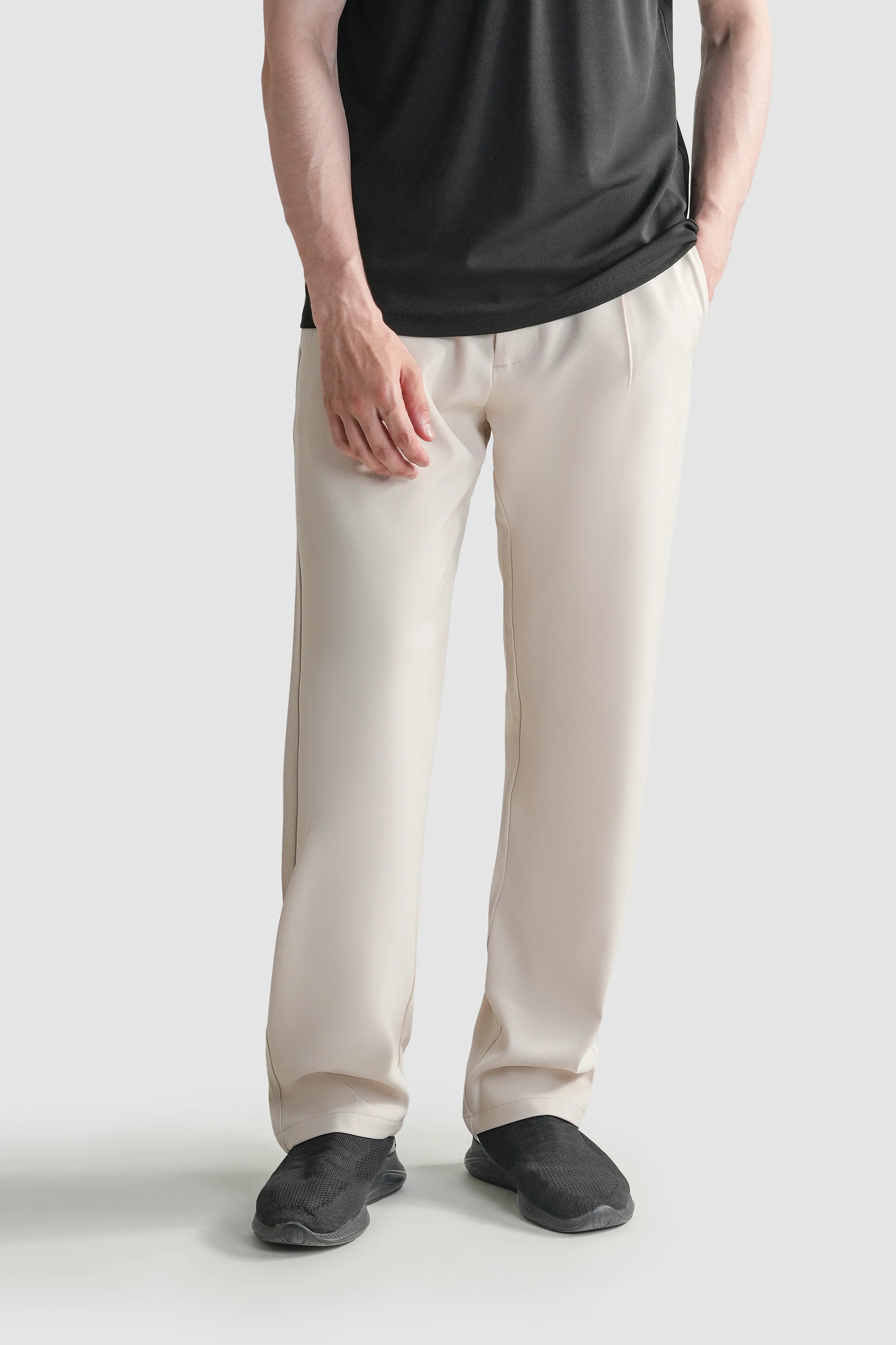 Beige straight-fit casual pants with front pockets and straight leg opening