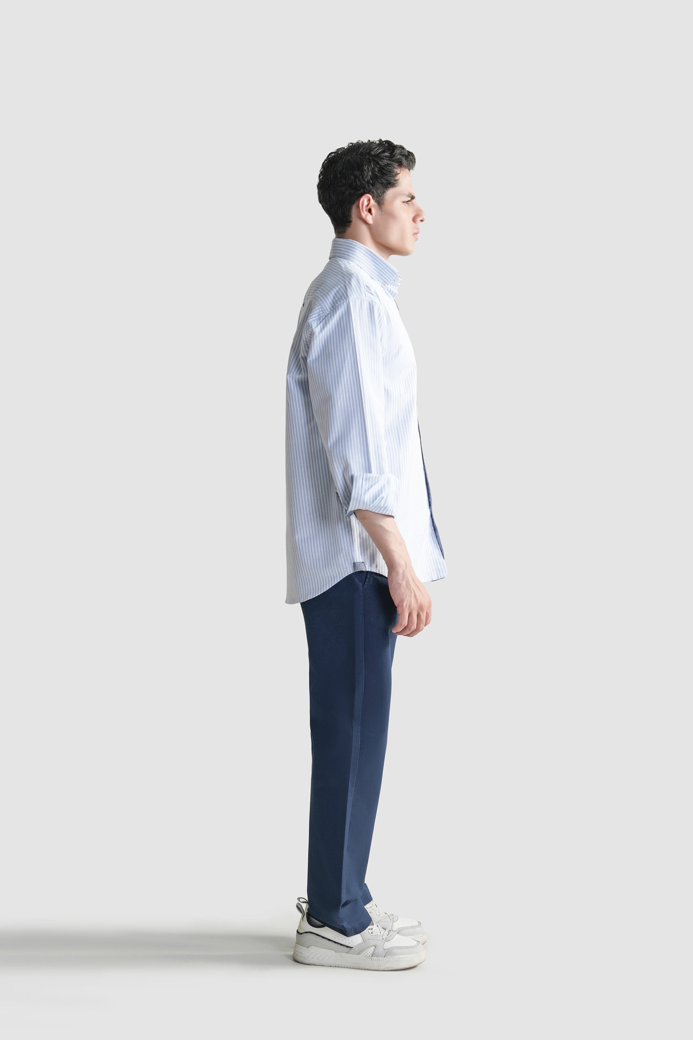 Men's light blue striped button-down casual shirt, side profile