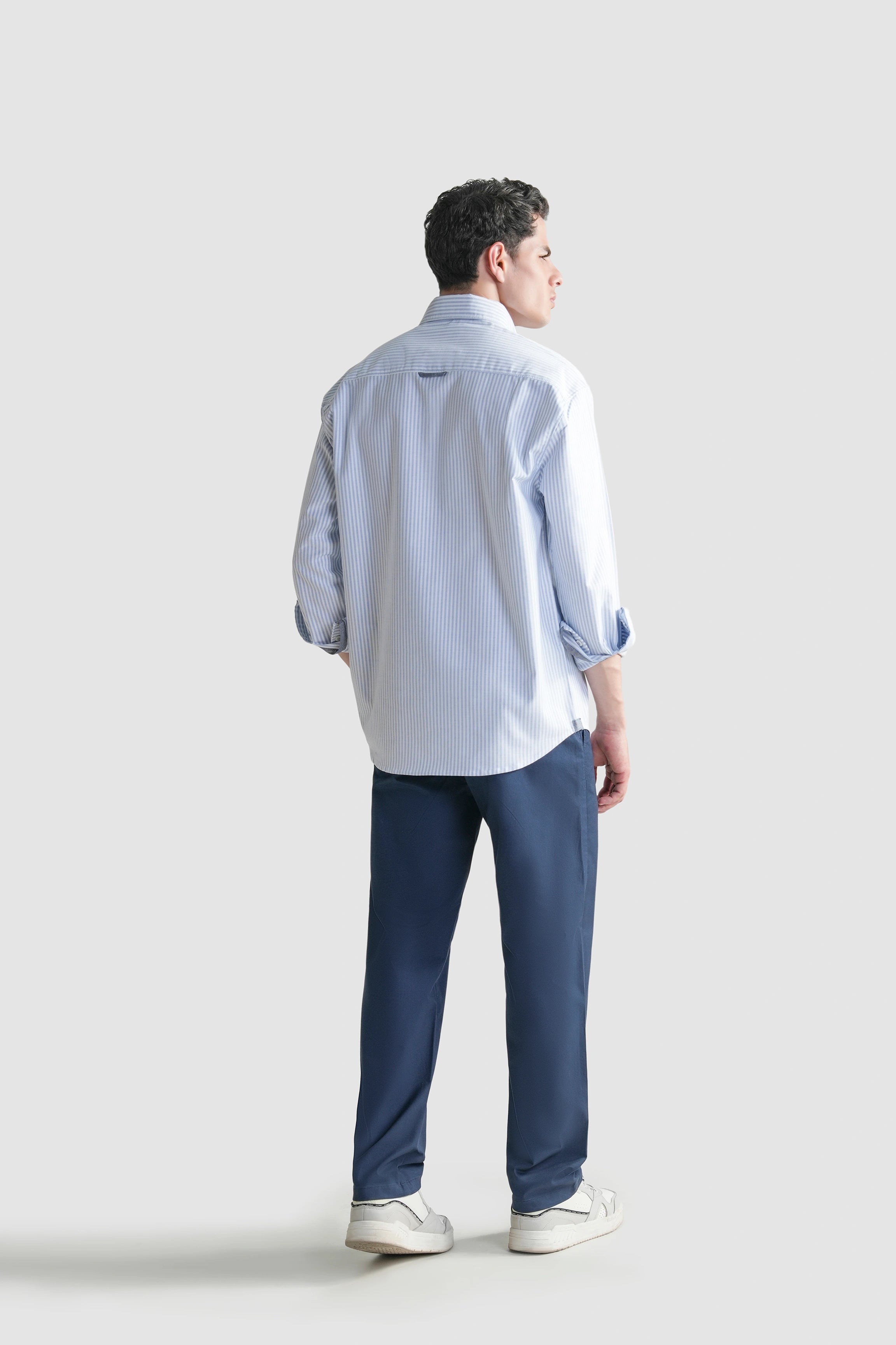 Men's light blue striped button-down casual shirt, back view