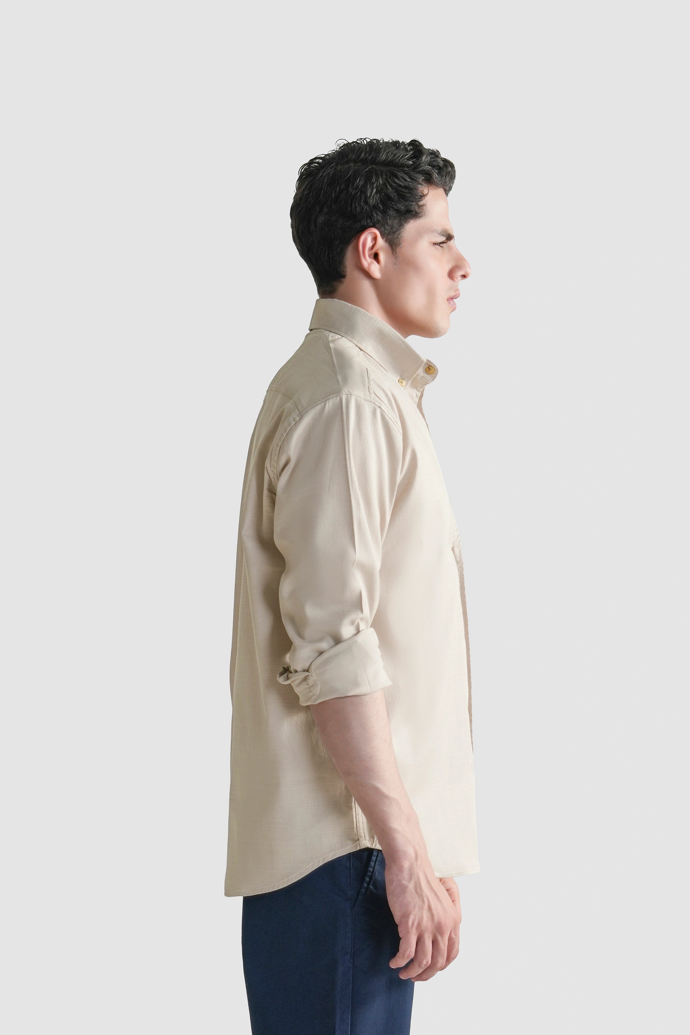 Light beige button-down casual shirt, side view with rolled sleeves and collar
