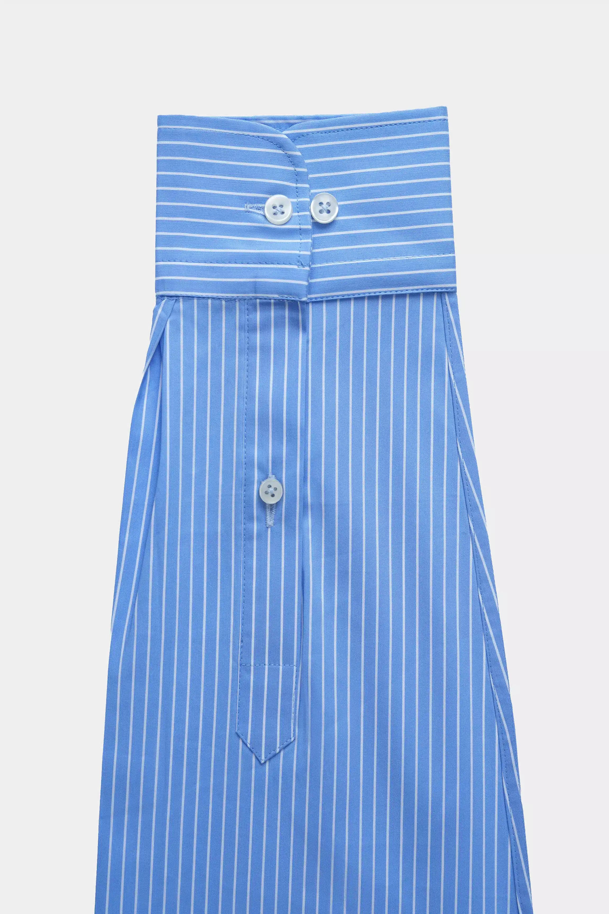 Light blue striped dress shirt with button front and fold-over collar