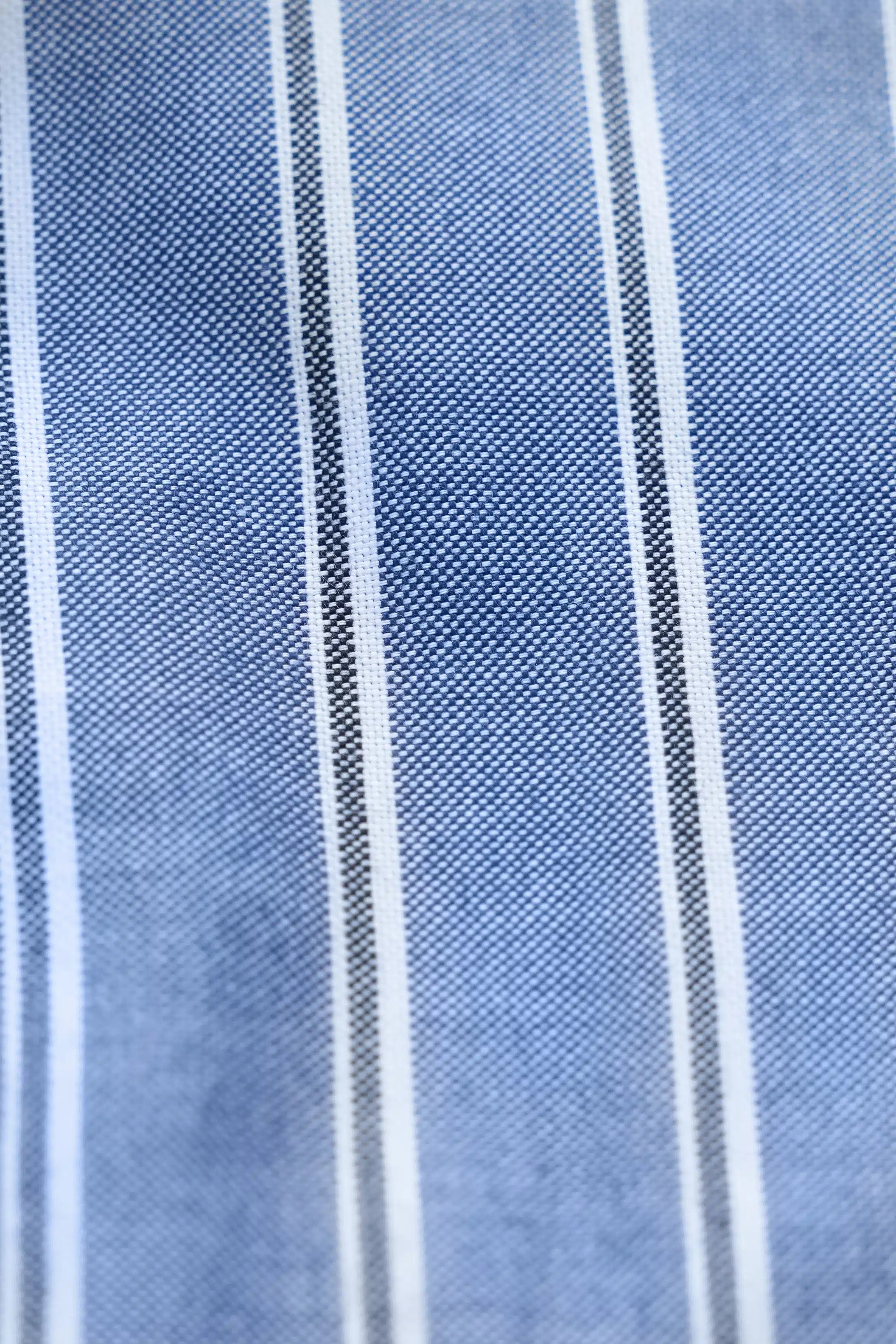 Chambray blue striped shirt fabric with white vertical pinstripes