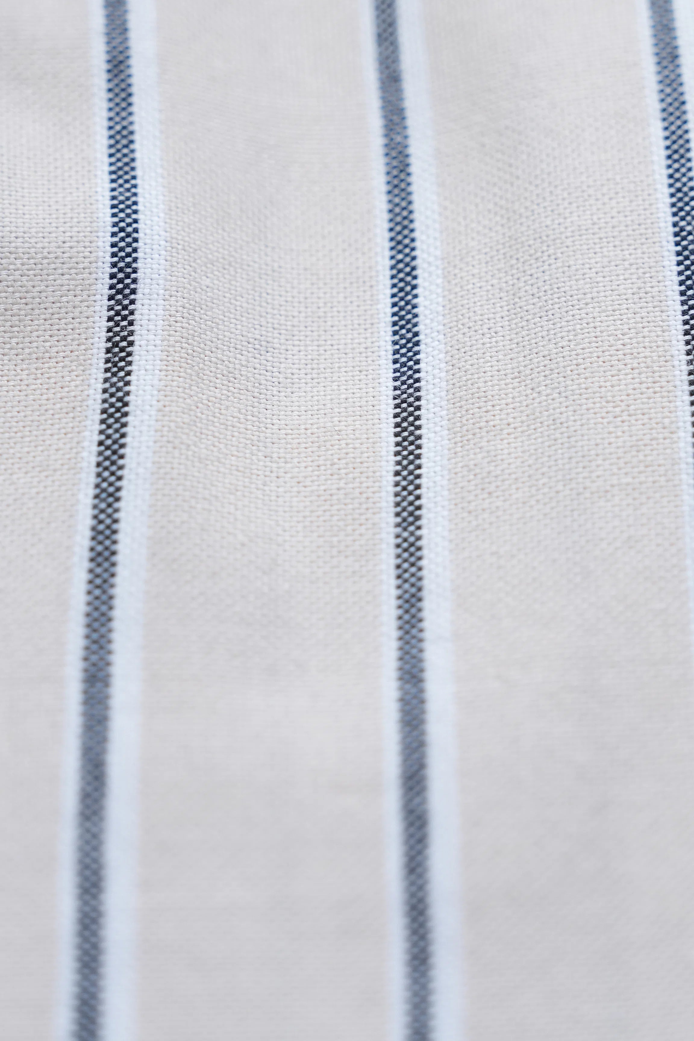 Cream fabric with navy vertical stripe pattern