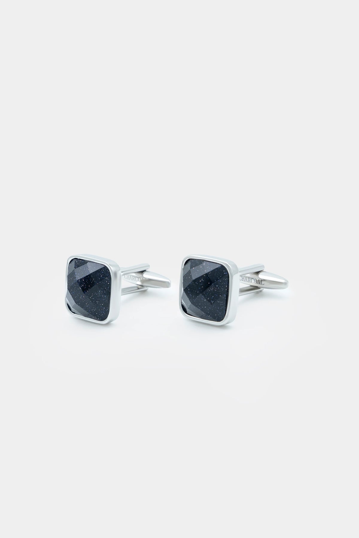 Square dark stone cufflinks with silver corner bezels, front view pair