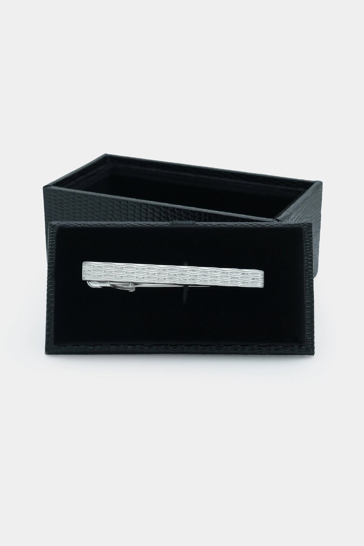 Silver tie pin displayed in a black gift box