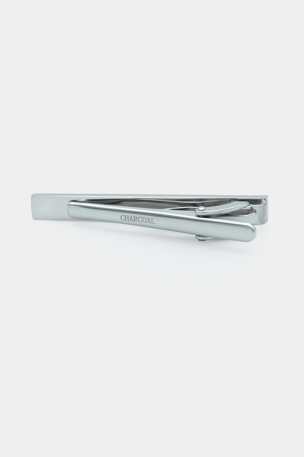 Silver tie pin with 'CHARCOAL' engraving and hinged back