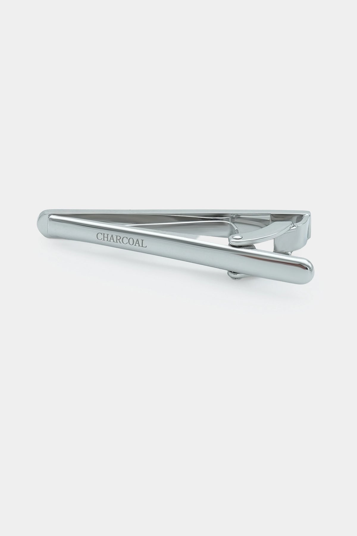 Silver tie pin showing CHARCOAL lettering on the bar