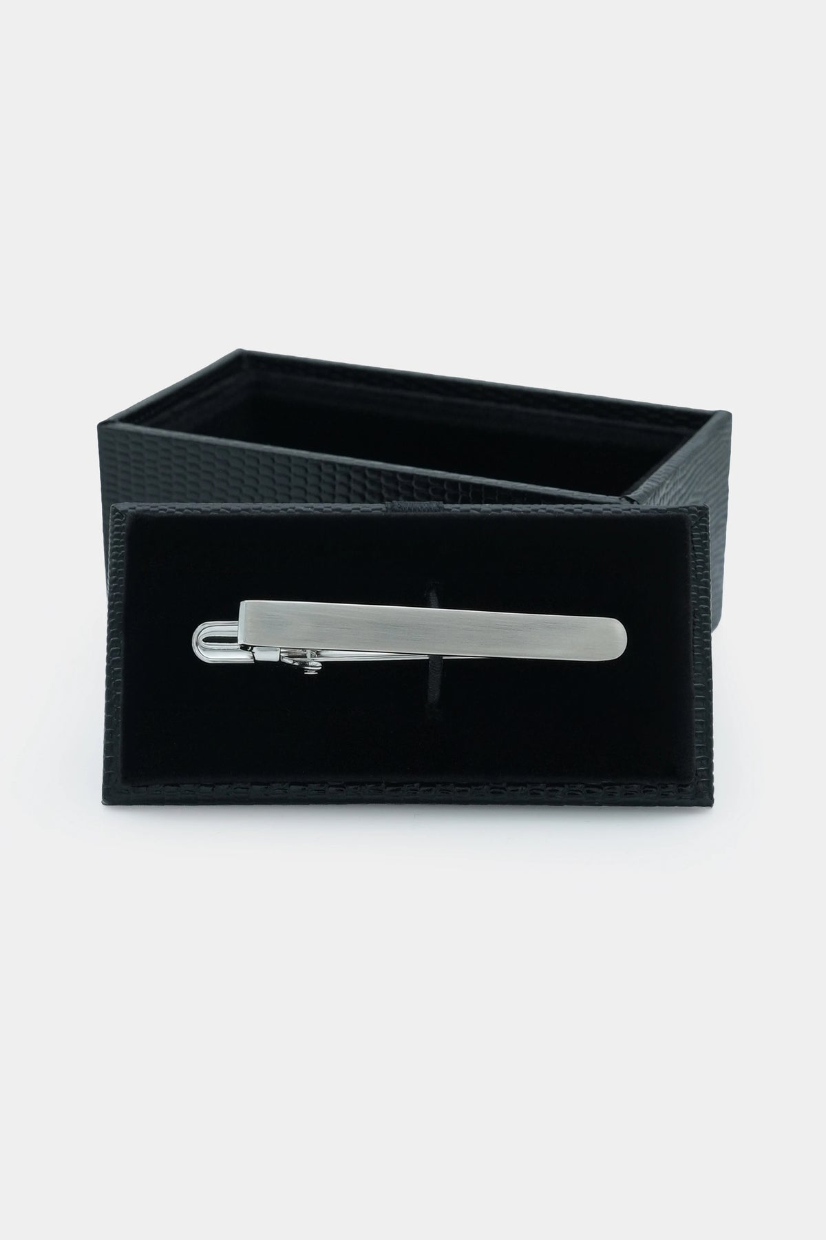 Silver tie pin in black fabric gift box