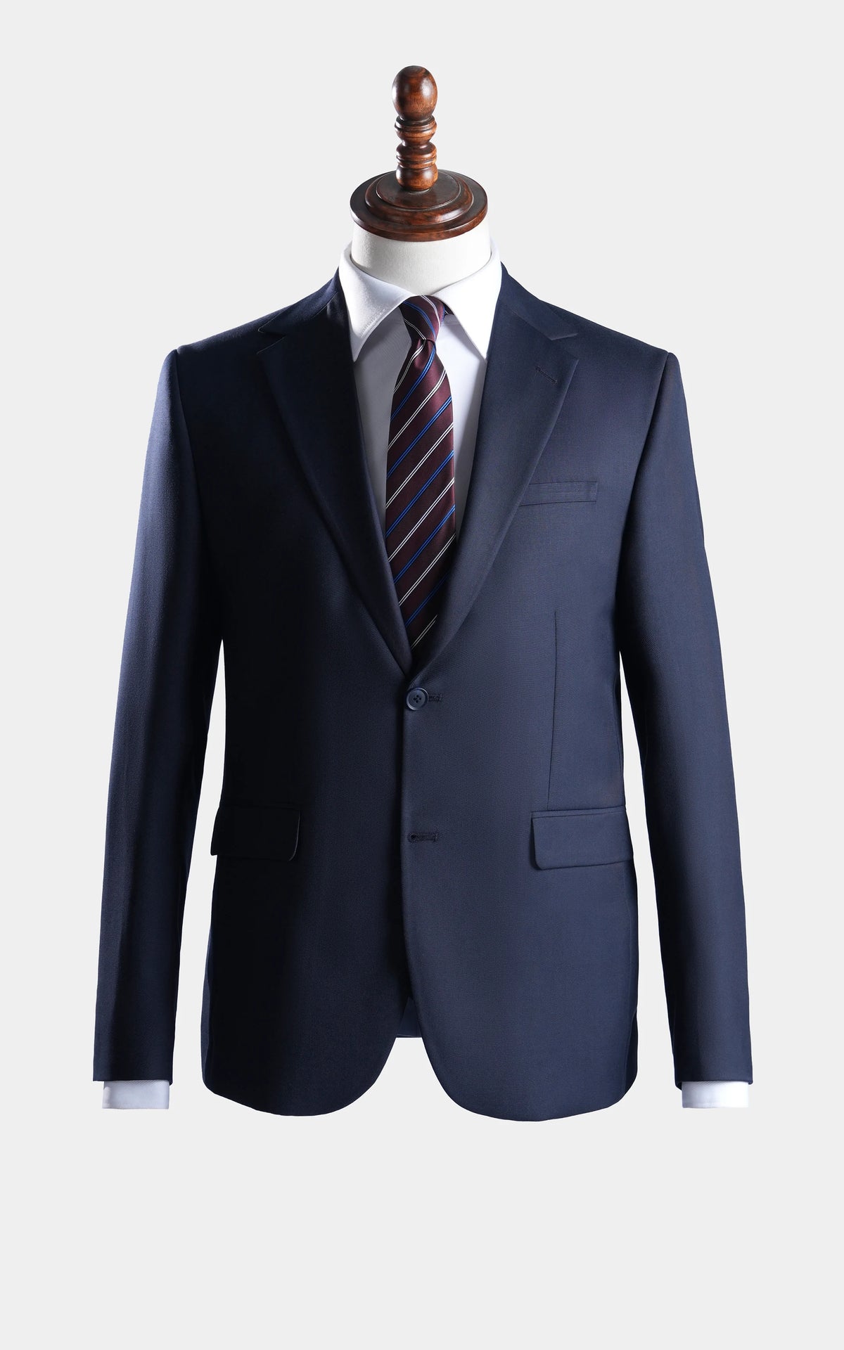 Navy two-piece suit set with notch-lapel blazer and matching trousers on mannequin