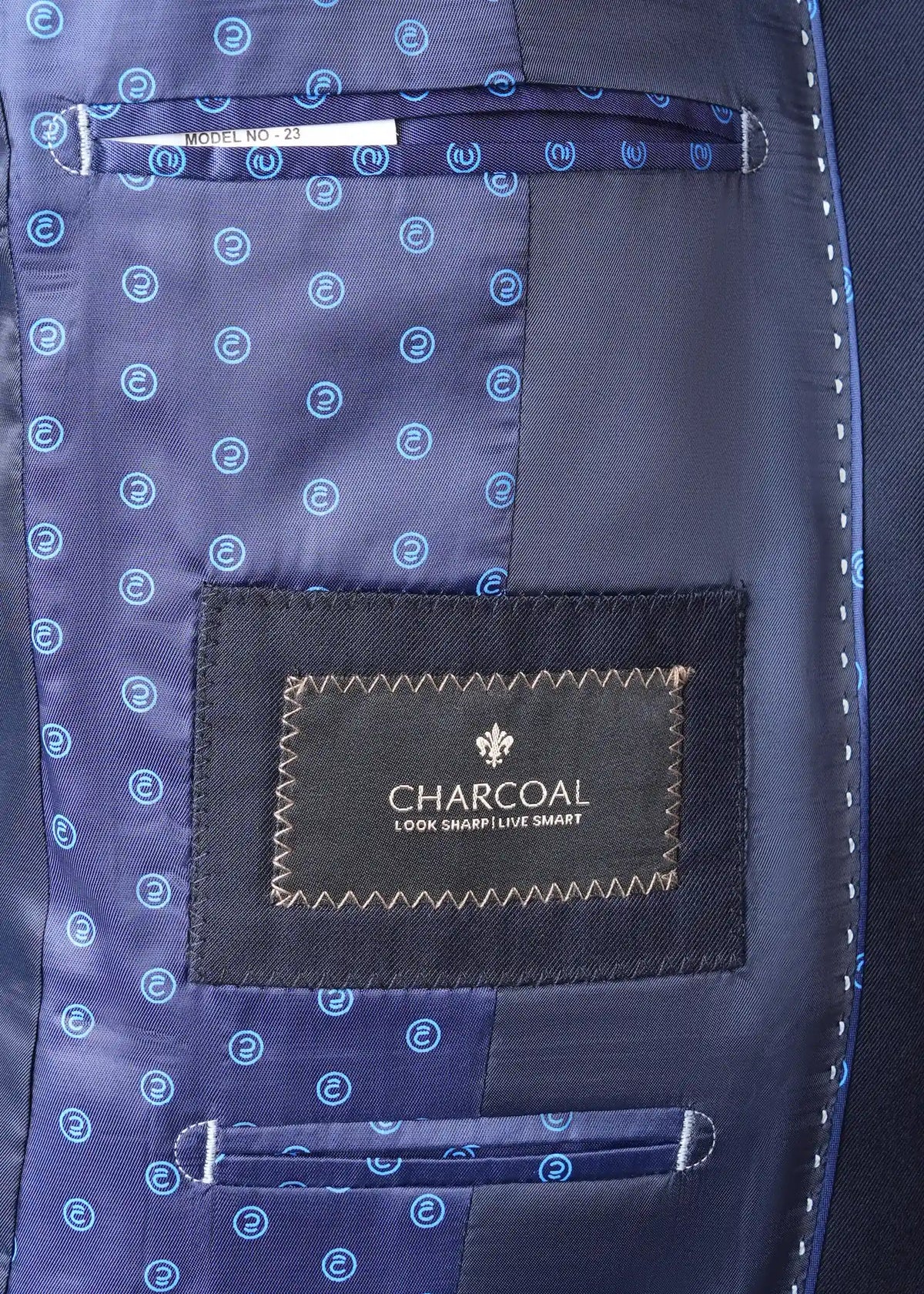 Navy suit lining with circular pattern and 'CHARCOAL' look sharp smart label