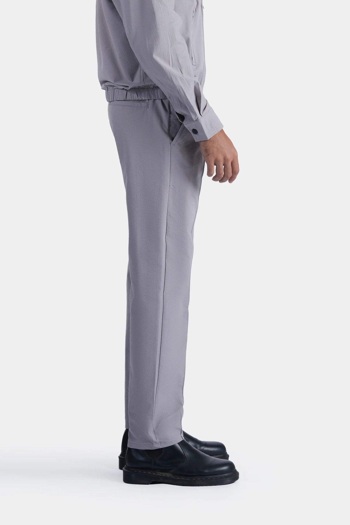 Light grey trousers with elastic cuff and side pocket opening