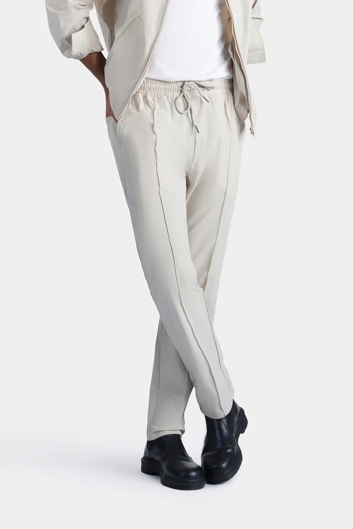 Beige seersucker trousers, stitched detailing and drawstring waist