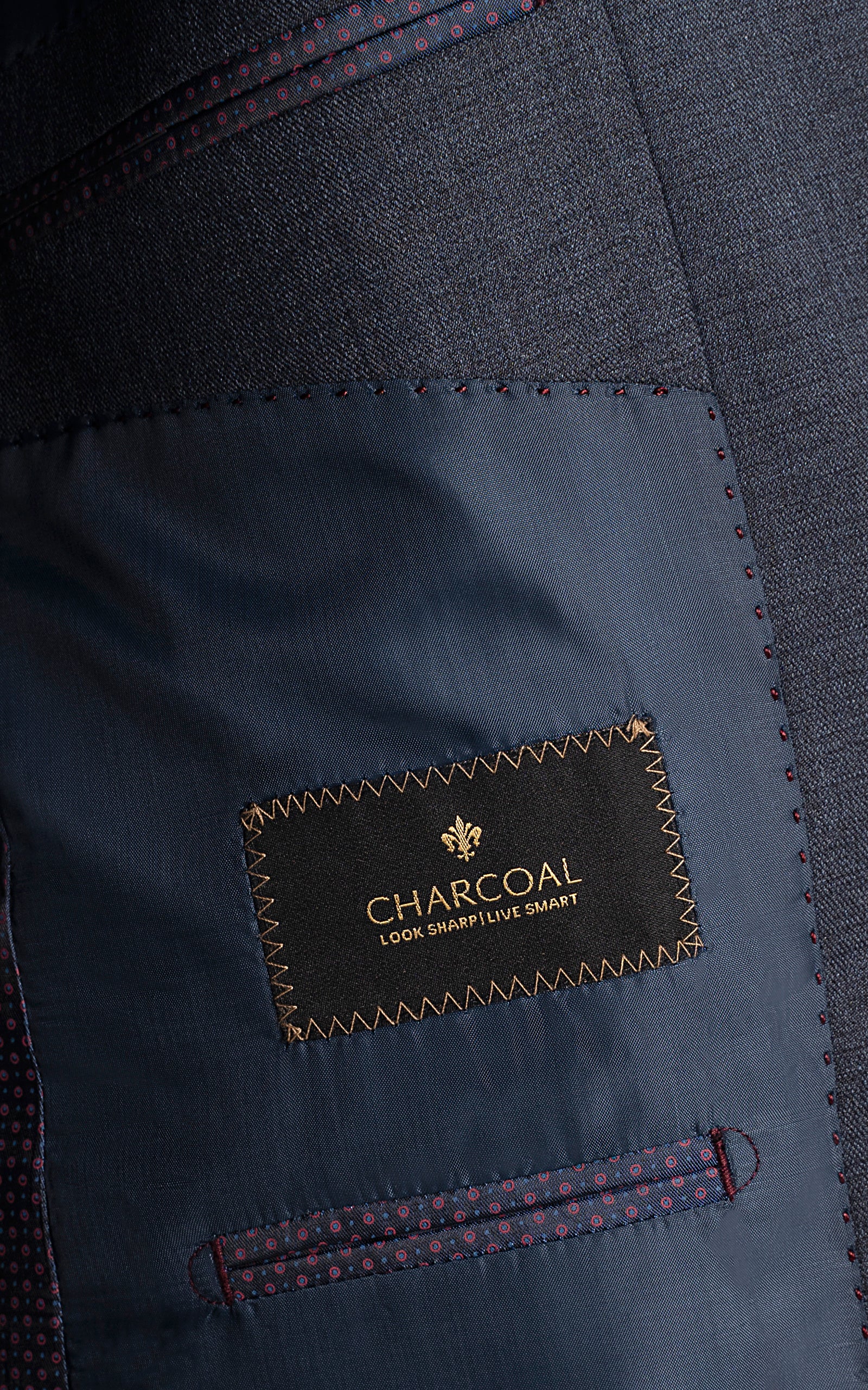 Charcoal size label on blue suit pocket lining