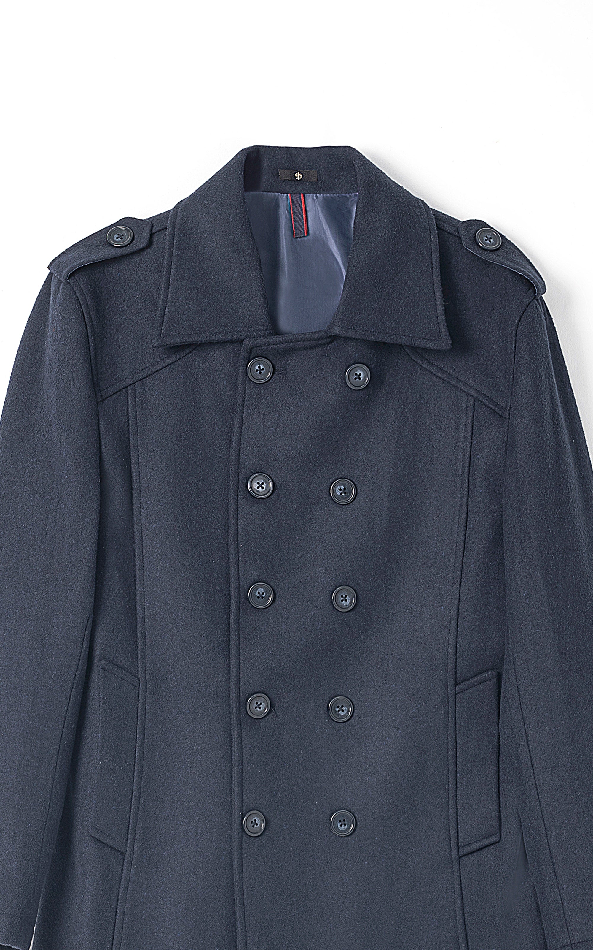 Close-up long double-breasted coat with dark blue lapels and button placket