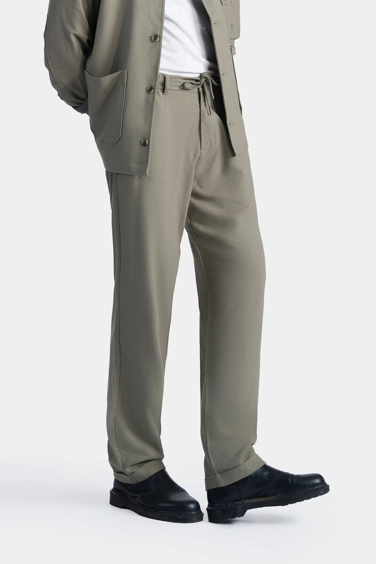 Light olive straight-fit trousers with waistband detail and side pockets