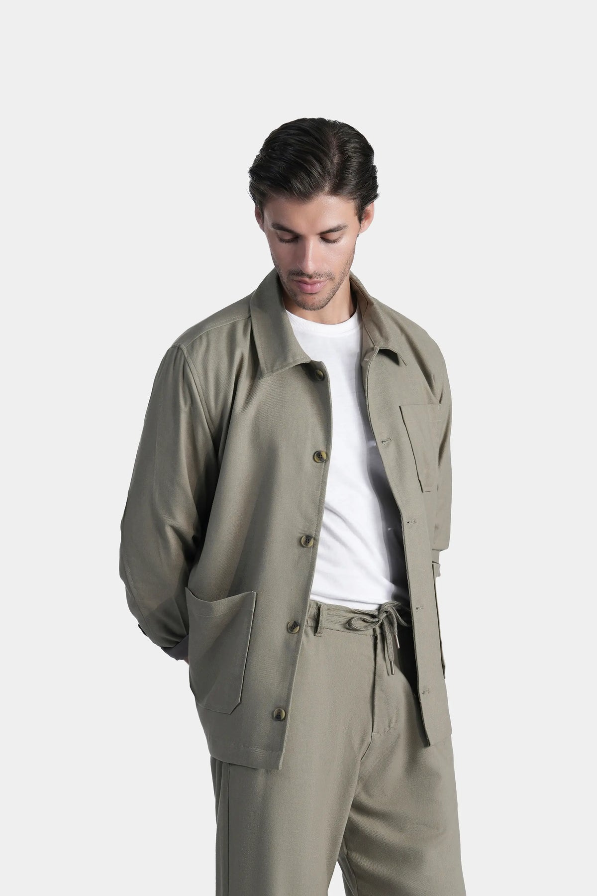 Olive shacket close-up: pointed collar, button front, chest pocket