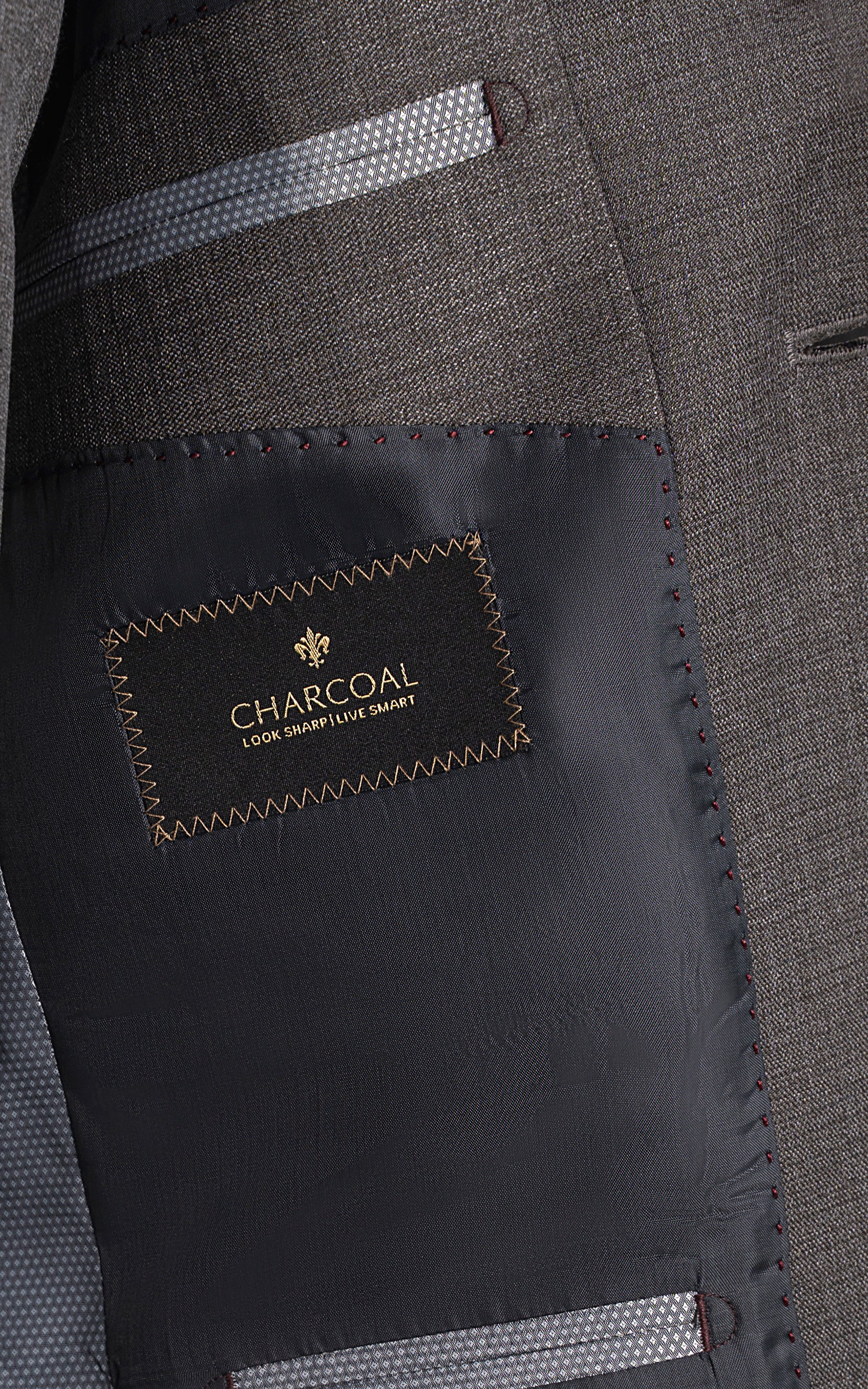 Charcoal brand lining label inside grey suit jacket pocket